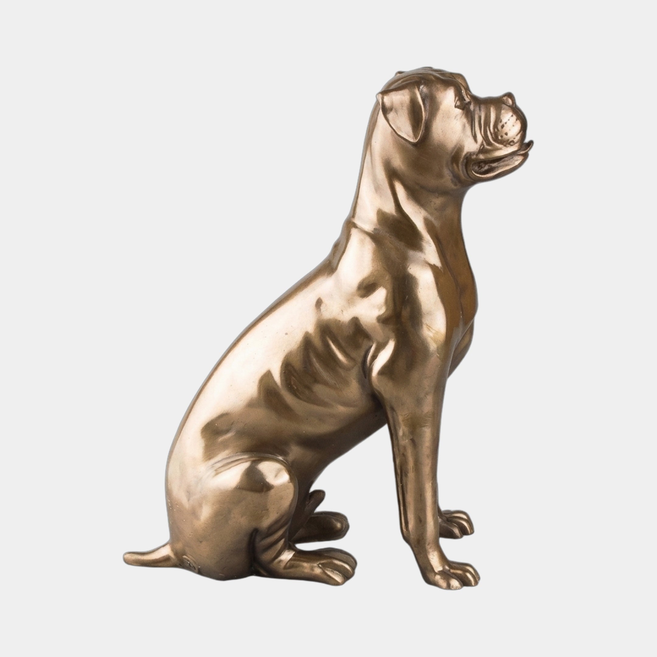 Life-Size Traditional Seated Boxer Dog Bronze Sculpture by Giant Sculptures, shown in side profile with a warm golden-brown patina against a plain light background.