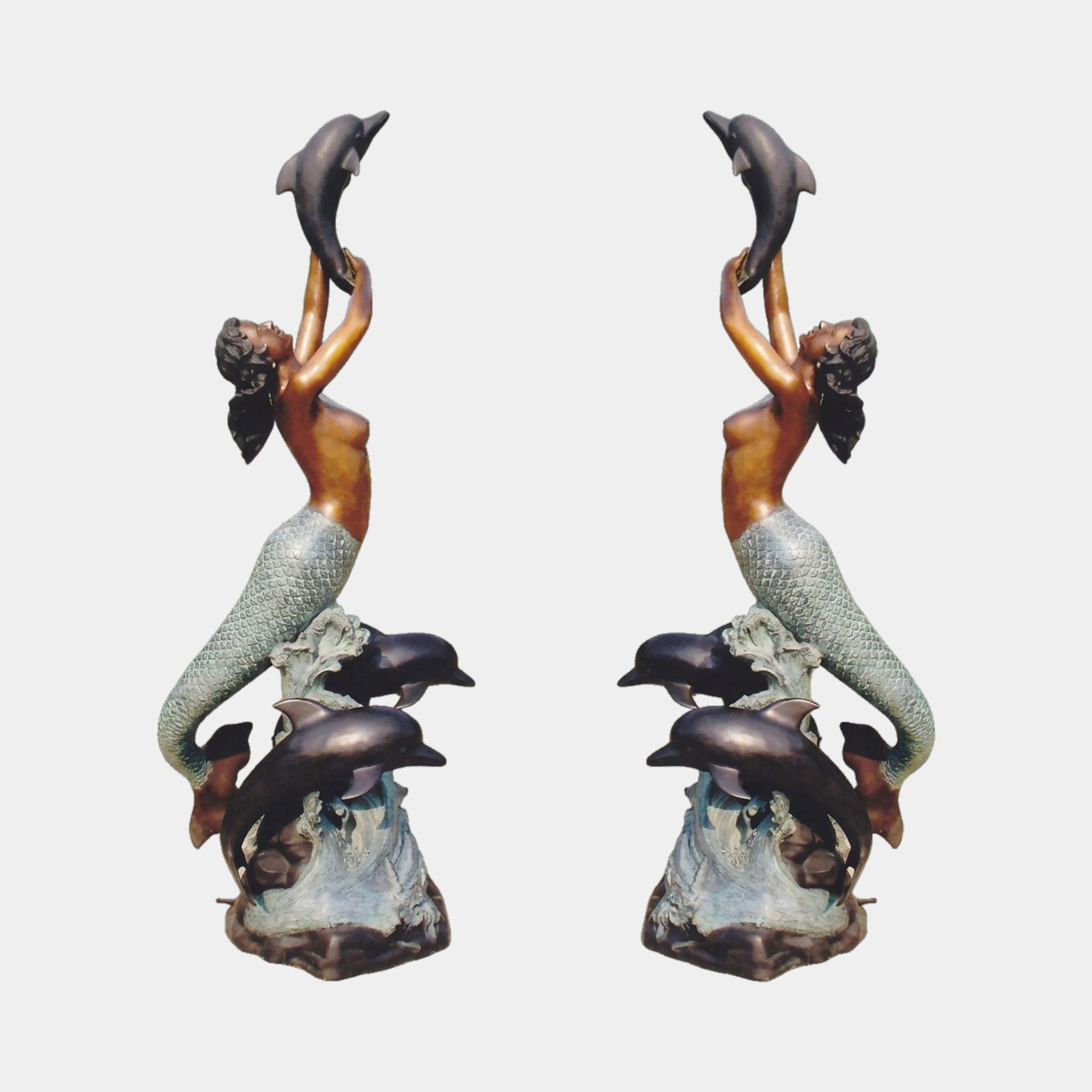 Mirrored view of the Monumental Classical Mermaid and Dolphin Bronze Sculpture by Giant Sculptures, mermaid lifting a dolphin overhead with verdigris tail and wave base.
