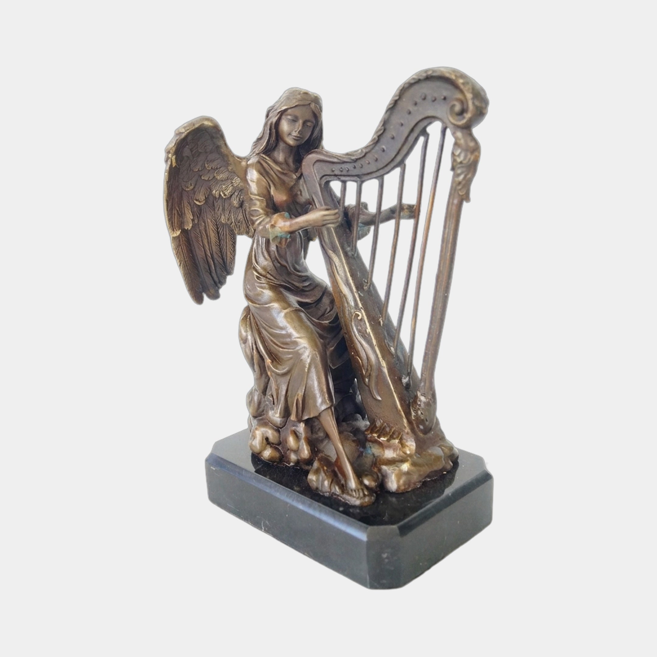Monumental Classical Seated Angel Harp Bronze Sculpture by Giant Sculptures, shown with dark brown patina, feathered wings and ornate harp, on a black base.