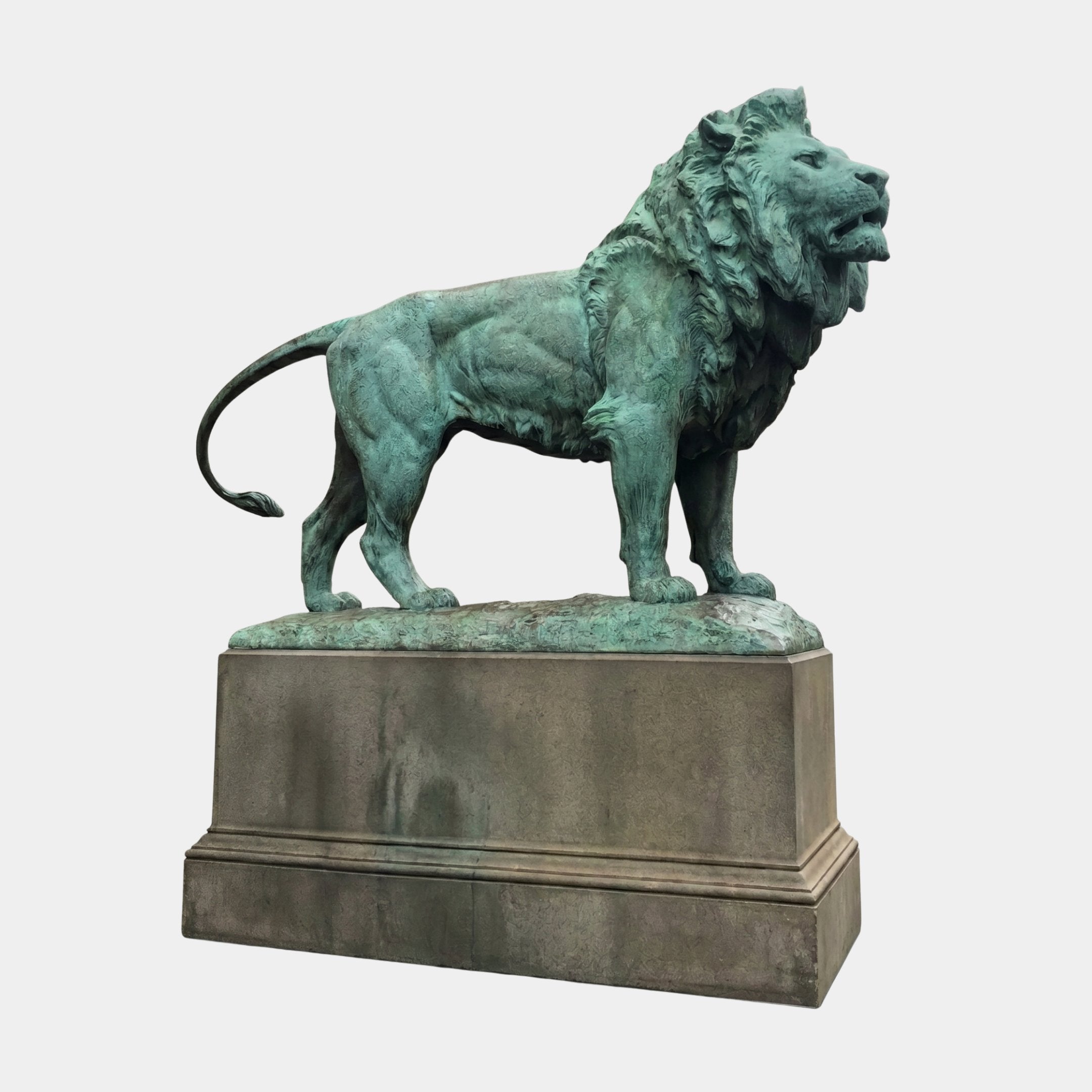 Monumental Classical Standing Lion Bronze Sculpture by Giant Sculptures with verdigris patina, shown in side profile on a stone pedestal against white.