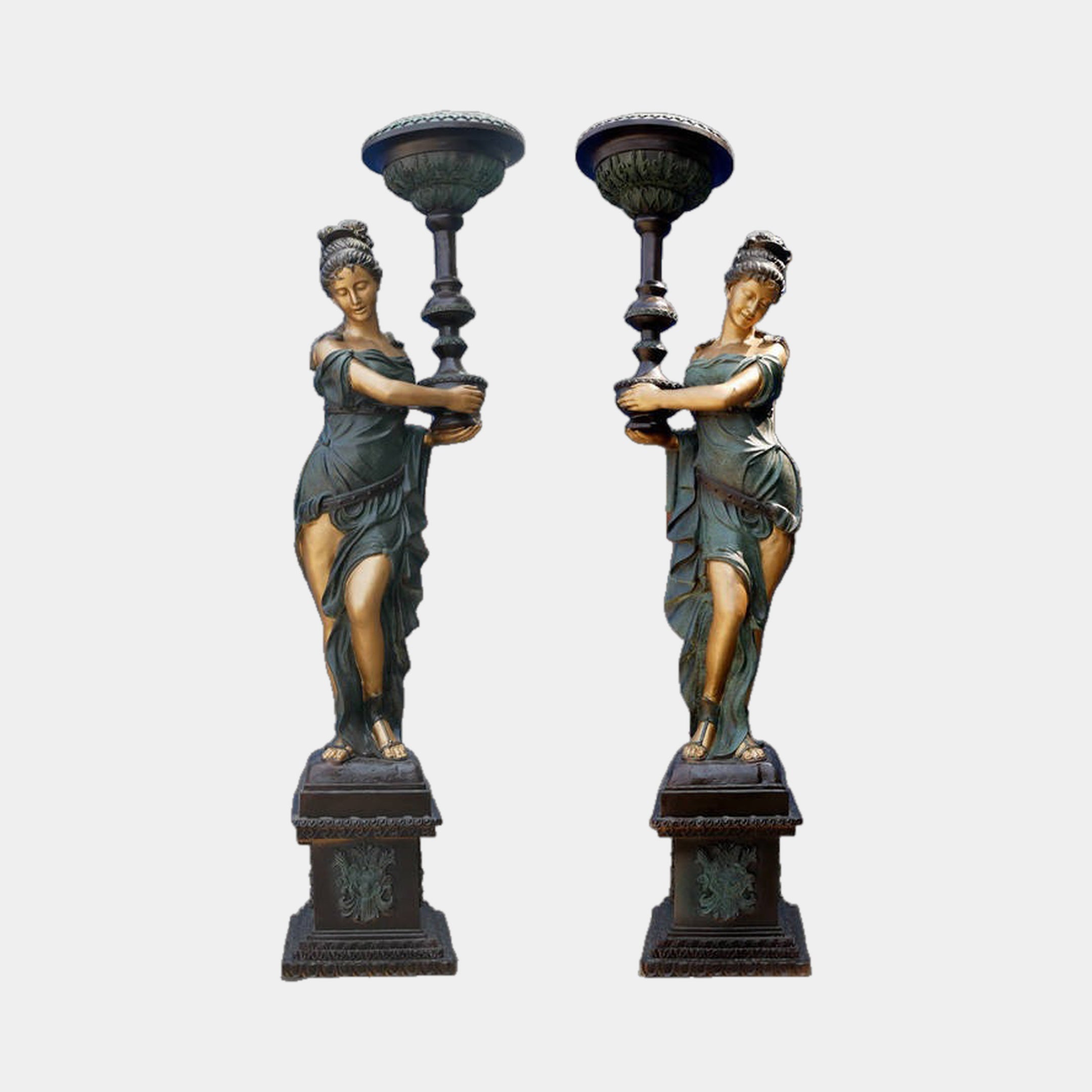 Monumental Classical Torch-Bearer Goddess Bronze Sculpture by Giant Sculptures, mirrored pair of draped 230cm figures with verdigris and gold patina on pedestals.