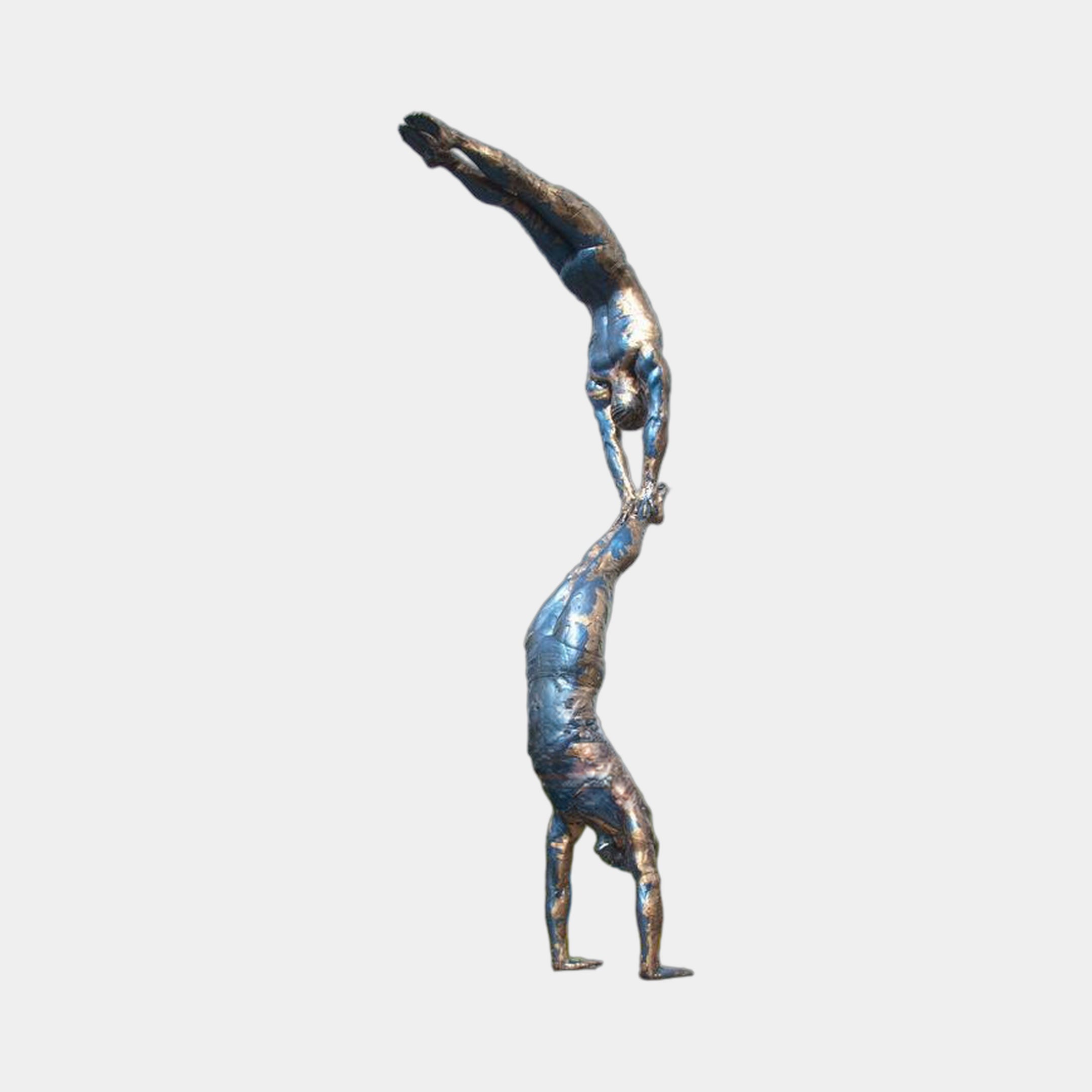 Monumental Contemporary Acrobatic Figures Bronze Sculpture by Giant Sculptures, two patinated bronze athletes stacked vertically in handstand pose against a plain background.
