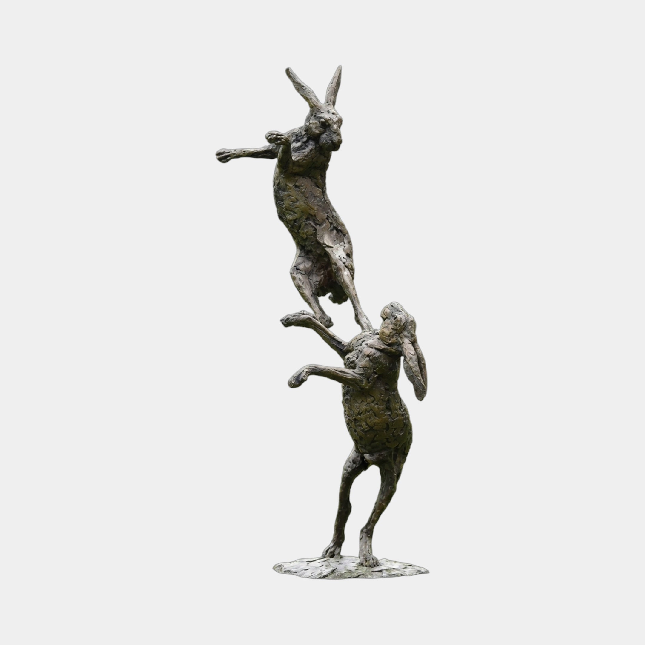 Monumental Contemporary Boxing Hares Bronze Sculpture by Giant Sculptures, 220cm, two stacked hares with dark brown and olive-green patina on plain background.