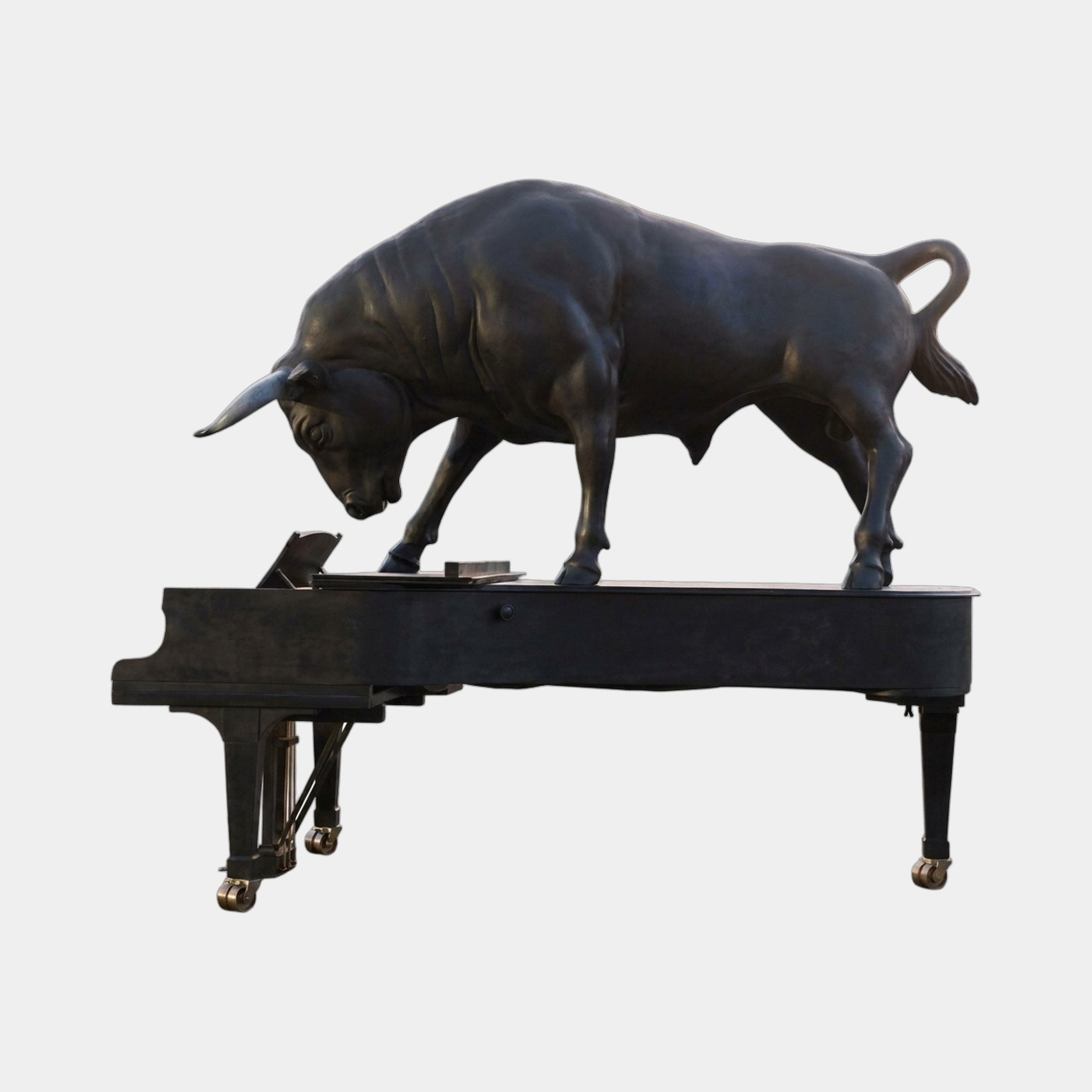 Monumental Contemporary Charging Bull on Grand Piano Bronze Sculpture 250cm by Giant Sculptures, matte black patina with gold-toned castors, side view.