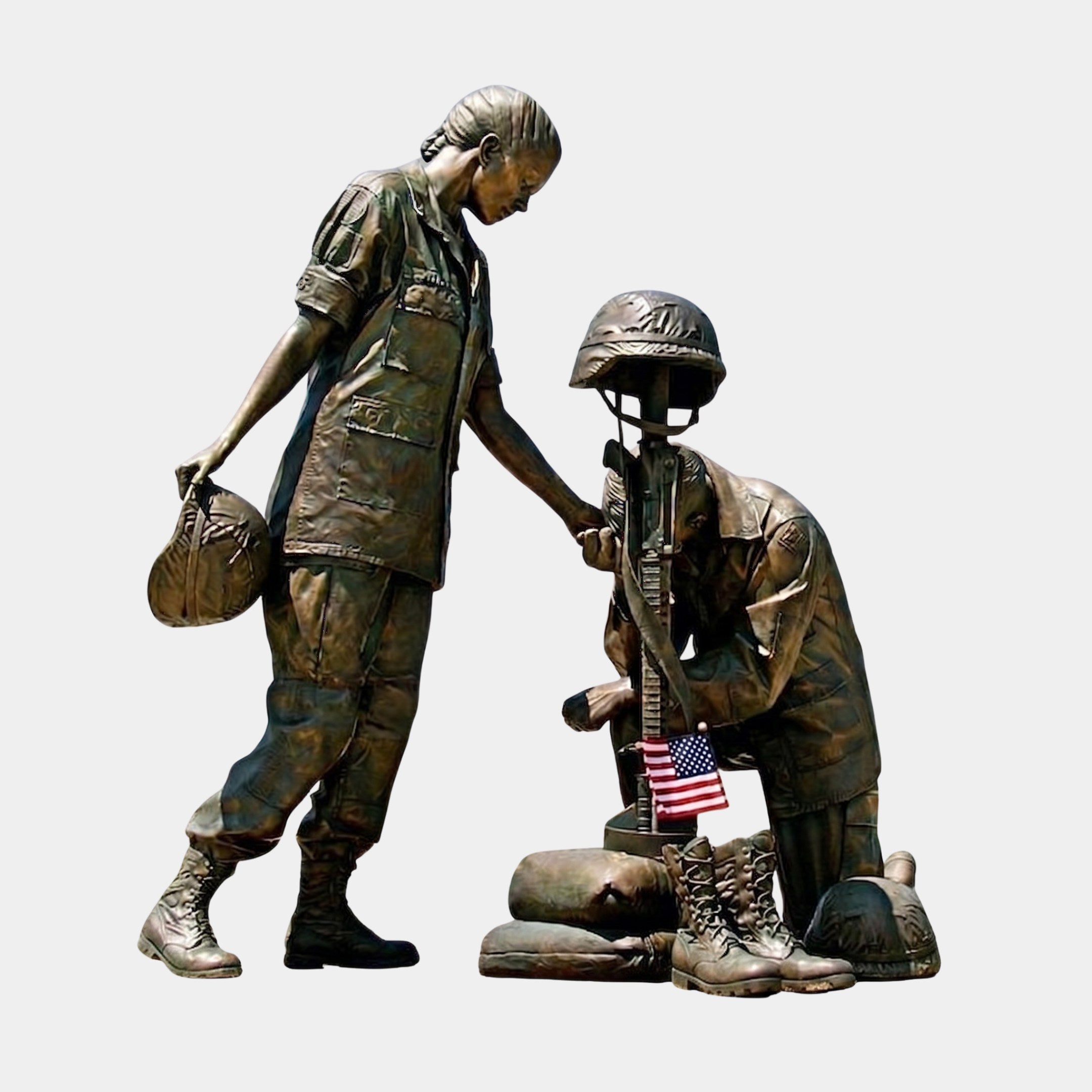 Giant Sculptures' Monumental Contemporary Female Soldier Memorial Bronze Sculpture showing a standing soldier reaching toward a kneeling comrade at a battlefield cross with US flag.