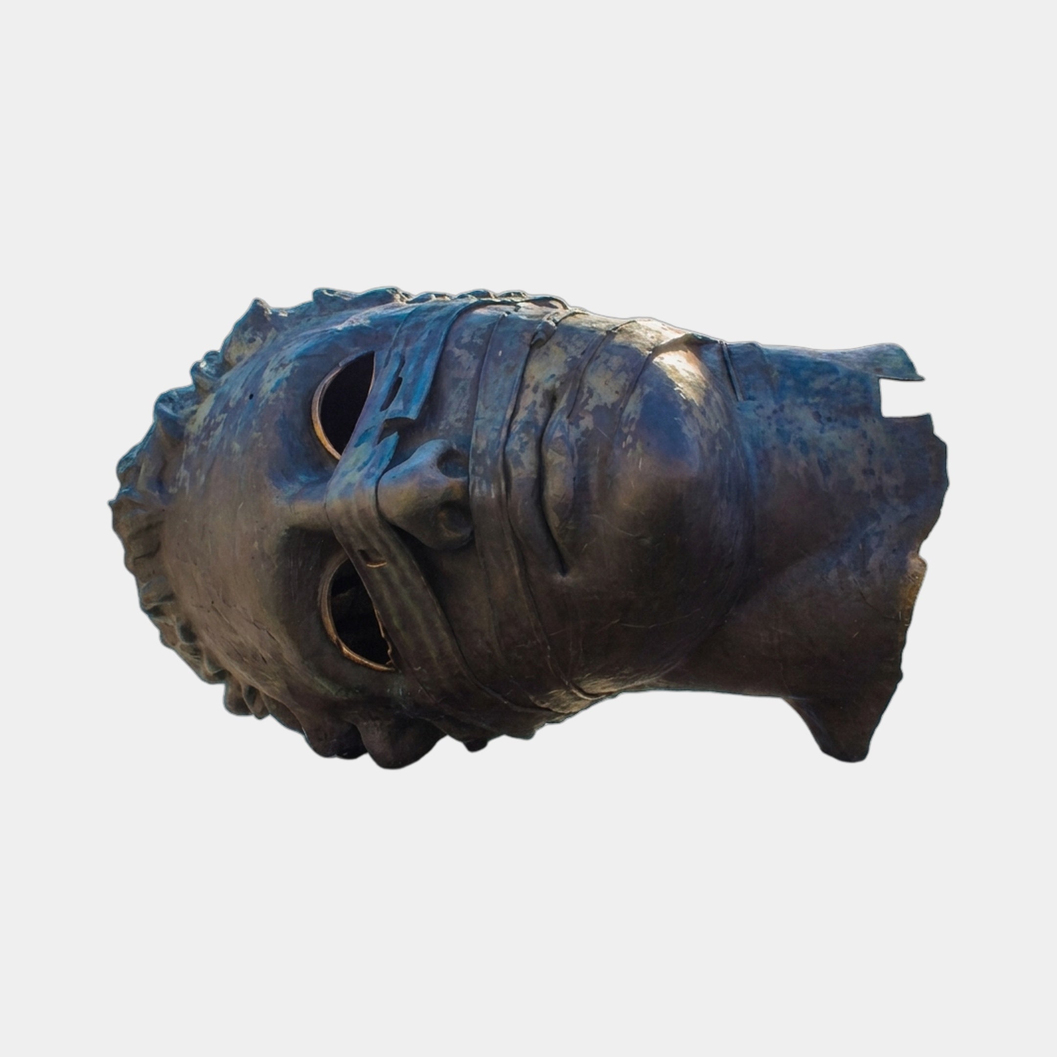 Monumental Contemporary Fragmented Head Bronze Sculpture by Giant Sculptures, shown horizontally with hollow eye sockets and segmented dark patina against a pale background.
