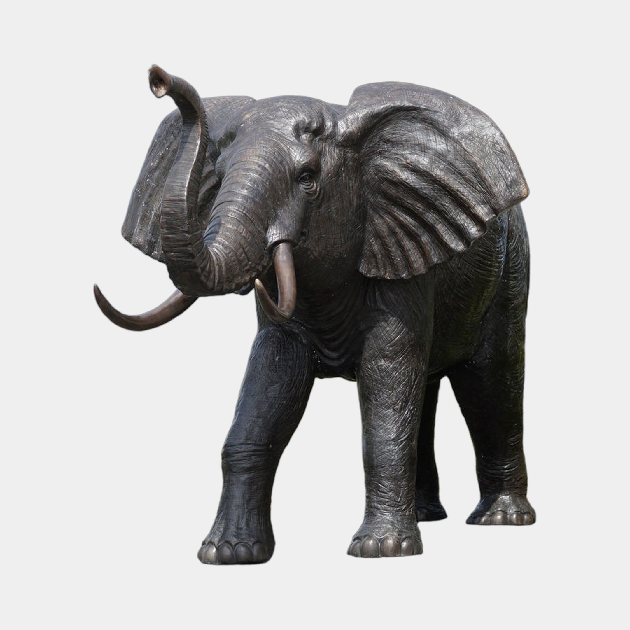 Giant Sculptures Monumental Traditional African Elephant Bronze Sculpture, 330cm, with raised trunk, fanned ears, and lighter-patina tusks on a plain background.