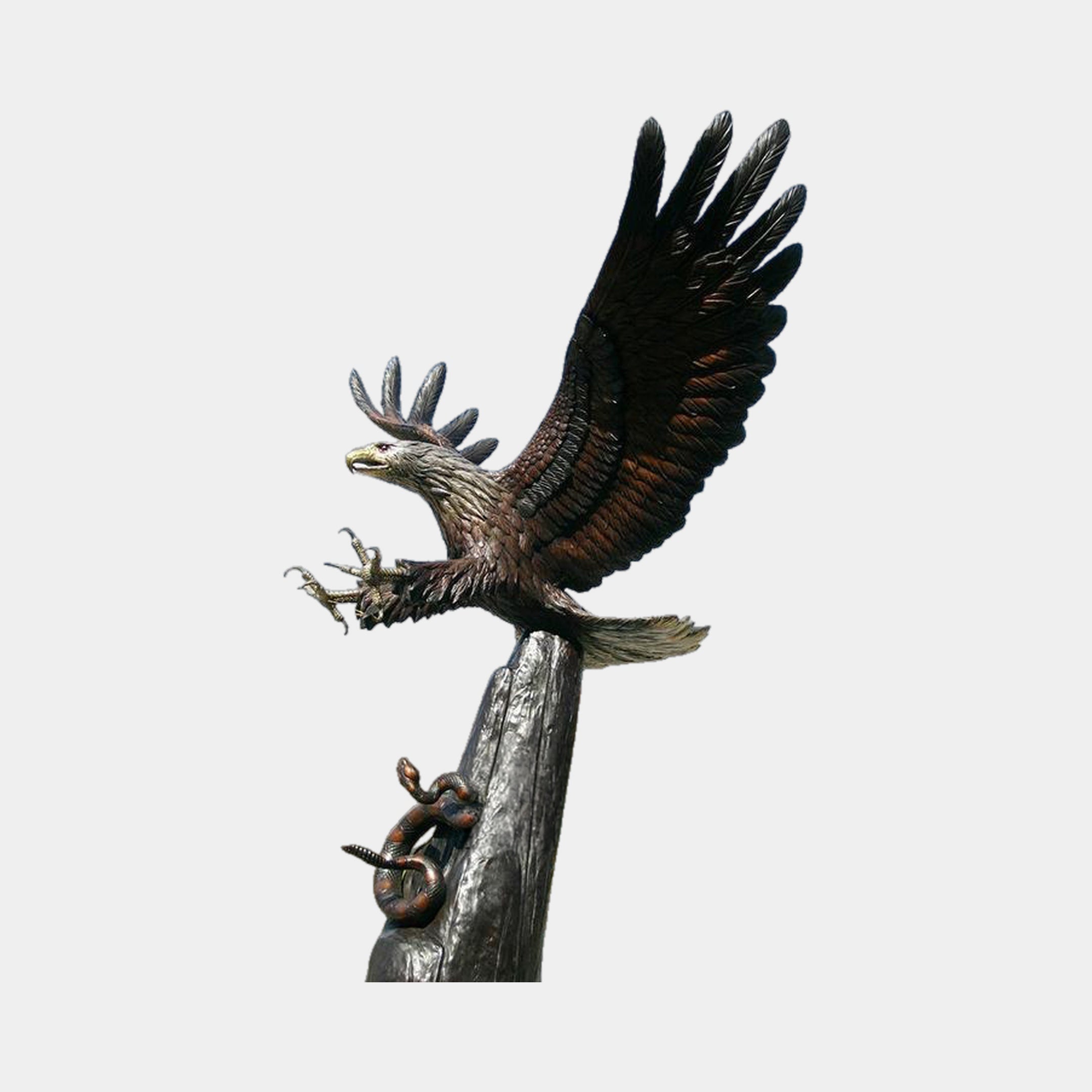 Monumental Traditional Eagle Bronze Sculpture by Giant Sculptures, 250cm, wings raised with talons extended atop a tree-trunk pillar entwined by a coiled snake.