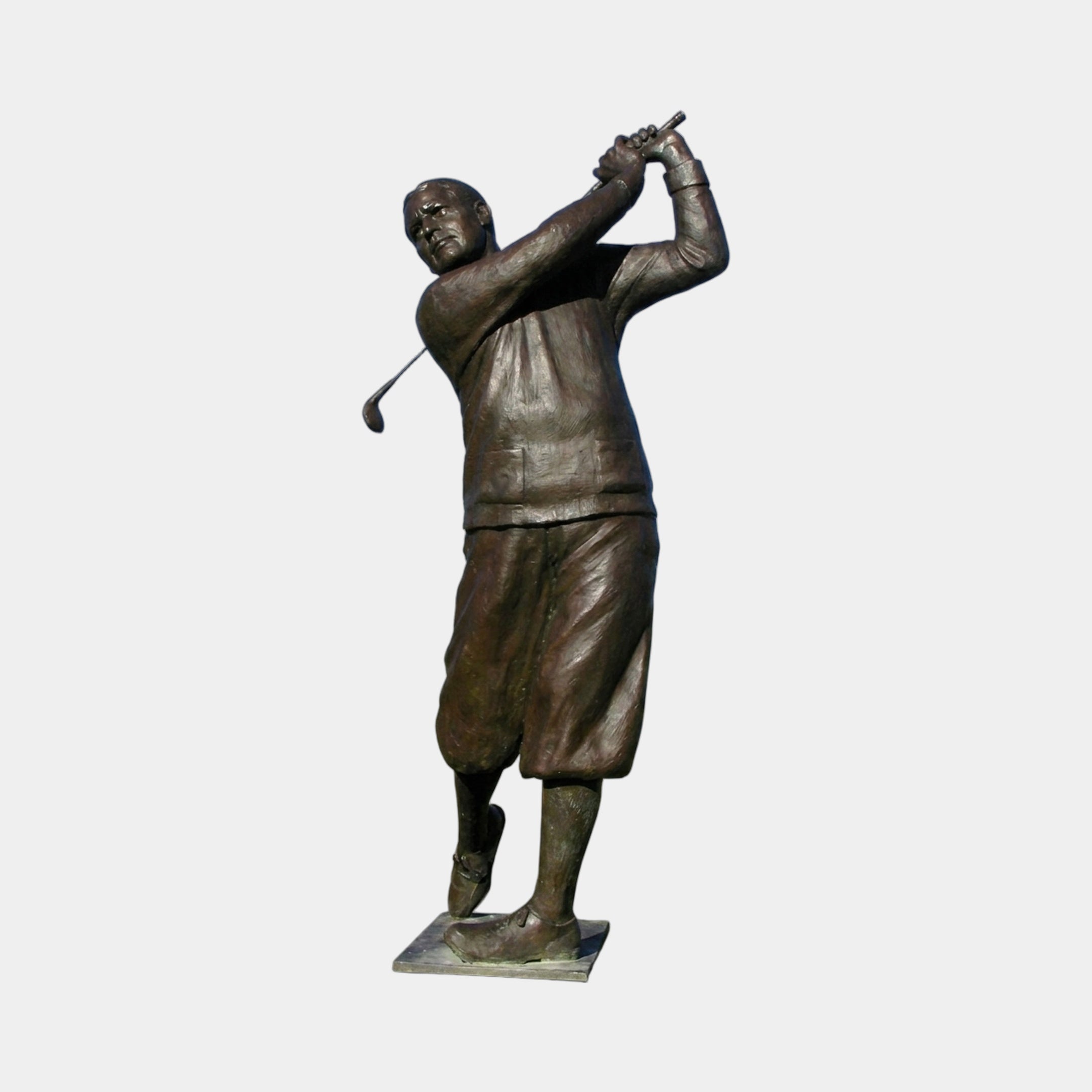 Monumental Traditional Golfer Bronze Sculpture by Giant Sculptures, 270cm dark brown patinated figure mid follow-through swing on a flat plinth, plain background.