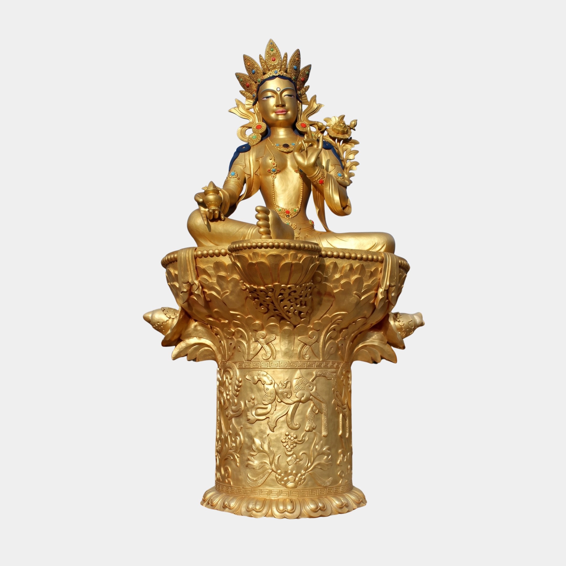 Giant Sculptures Monumental Green Tara Goddess bronze sculpture in hand-finished gold, seated in lotus pose on a tiered lotus throne with jewelled crown, plain background.