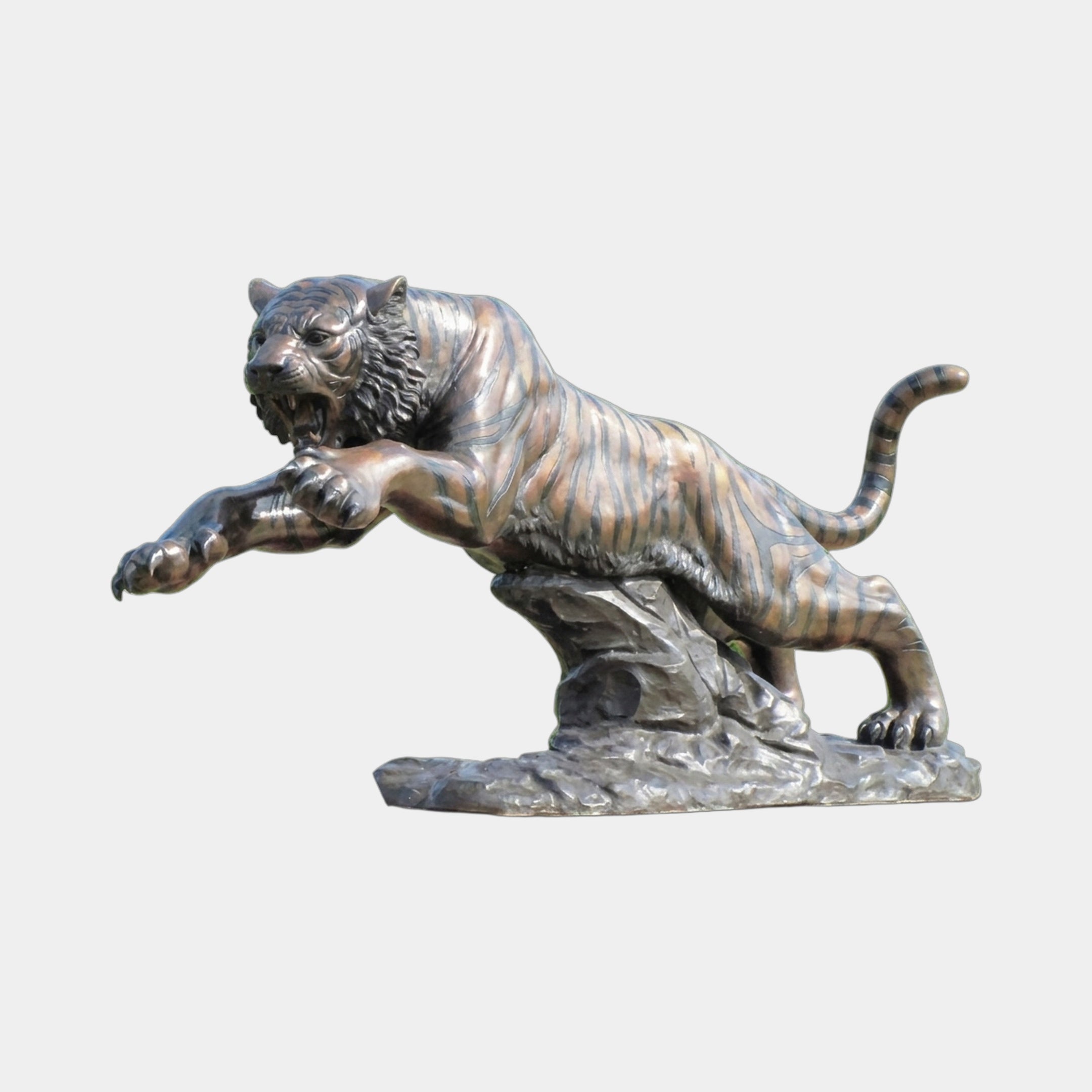 Monumental Traditional Leaping Tiger Bronze Sculpture by Giant Sculptures, mid-pounce with claws extended and jaws open, warm brown patina on a rocky base.