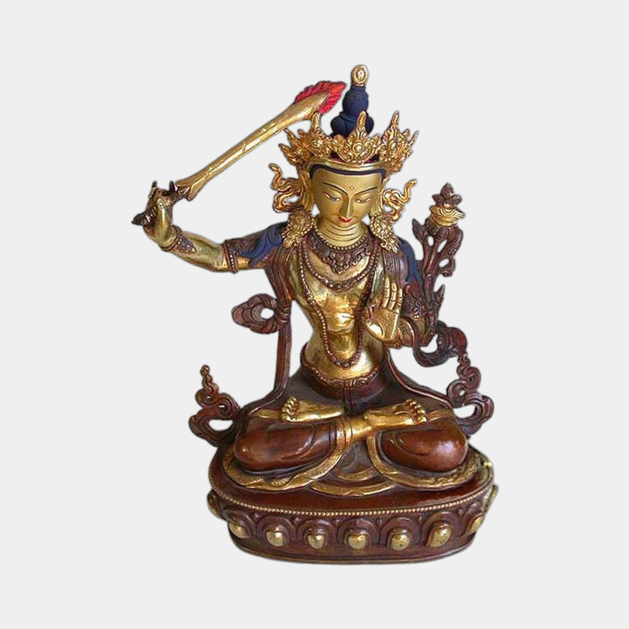 Monumental Traditional Manjushri Seated Bronze Sculpture by Giant Sculptures, gilded figure raising flaming sword, reddish-brown lotus throne, plain background.