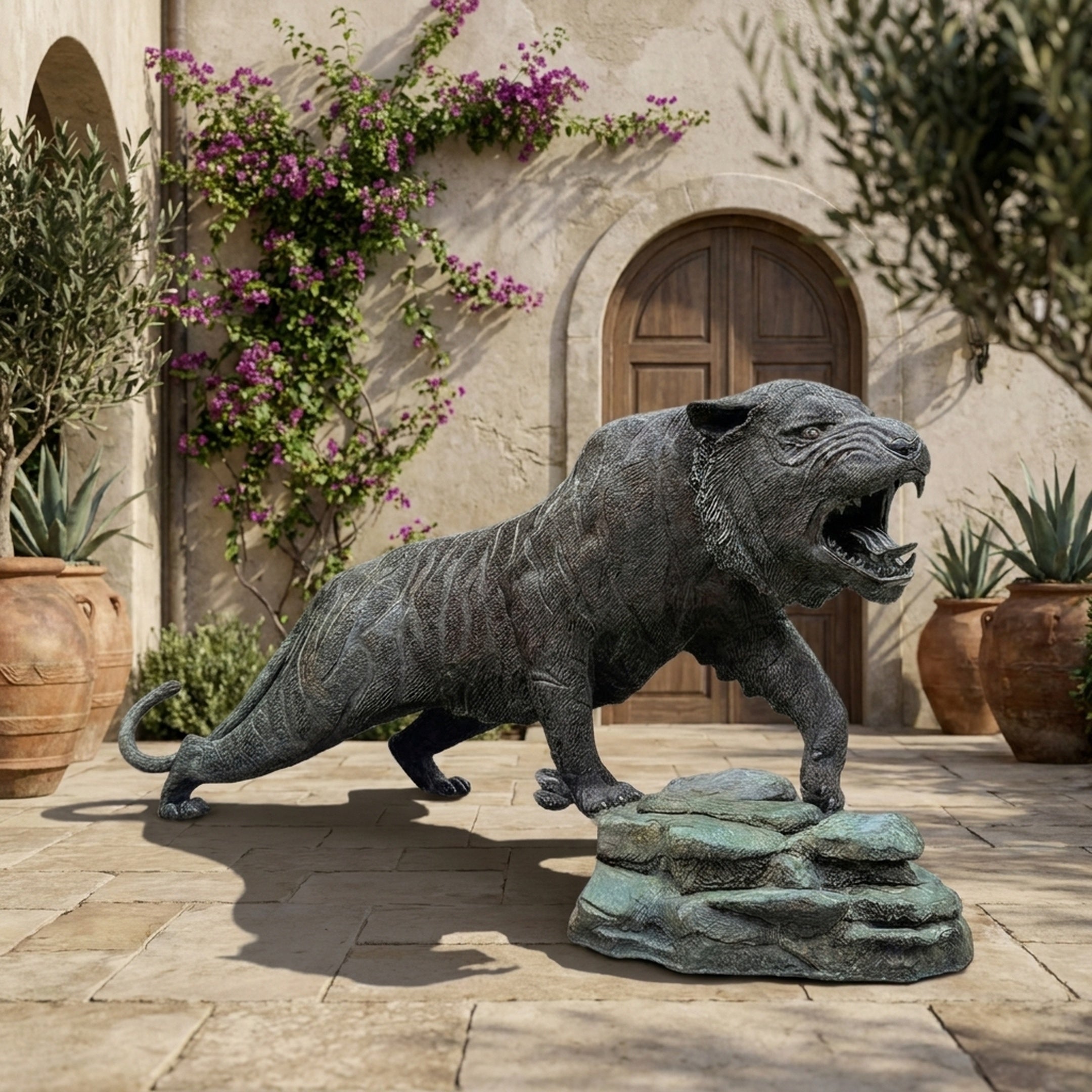 Giant Sculptures Monumental Traditional Roaring Tiger Bronze Sculpture 300cm in mid-lunge on a verdigris rock base, displayed in a Mediterranean courtyard.