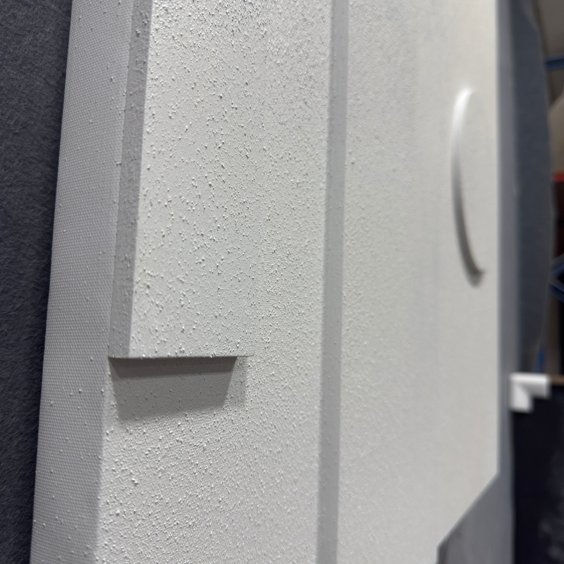 Close-up of the Moro III Triptych White Relief 3D Wall Art by Giant Sculptures, showcasing raised rectangular and circular forms on a textured white surface with shadows that highlight its minimalist, geometric patterns.