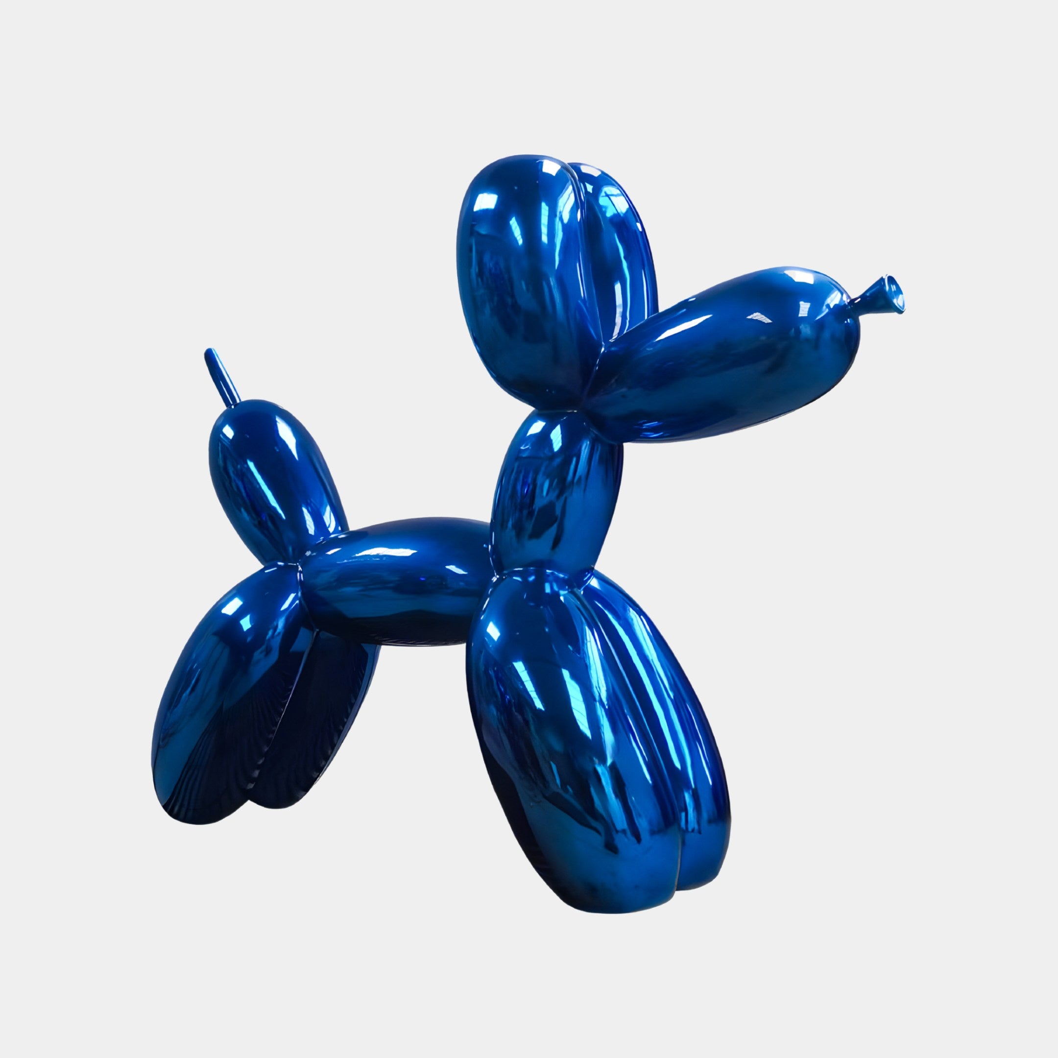 The Ocean Blue Balloon Dog Sculpture by Giant Sculptures, standing at 80cm, shines brightly as a modern art piece against a plain white background, ideal for contemporary interiors.