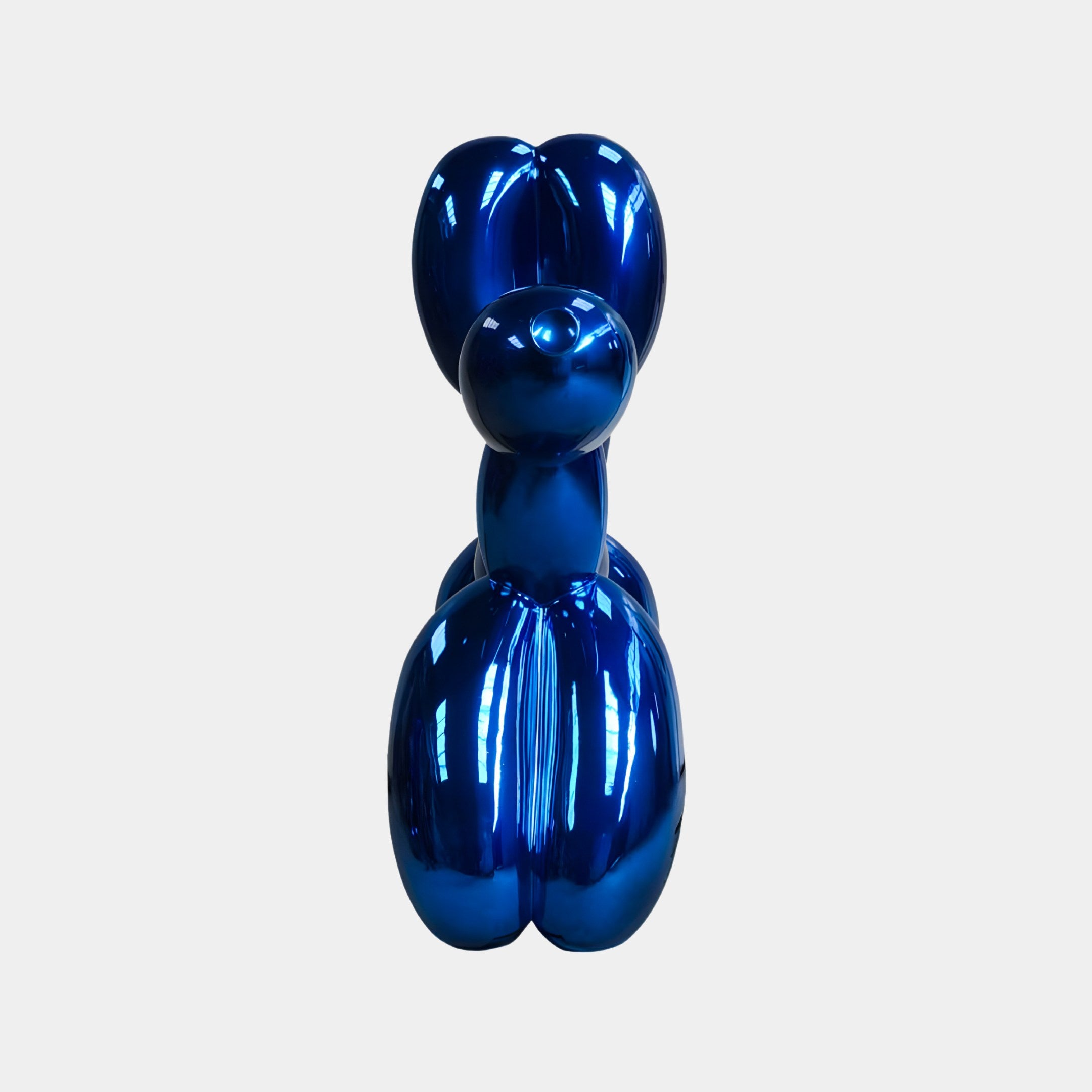 The Ocean Blue Balloon Dog Sculpture (80cm) by Giant Sculptures stands elegantly against a plain white background, radiating the essence of modern art.
