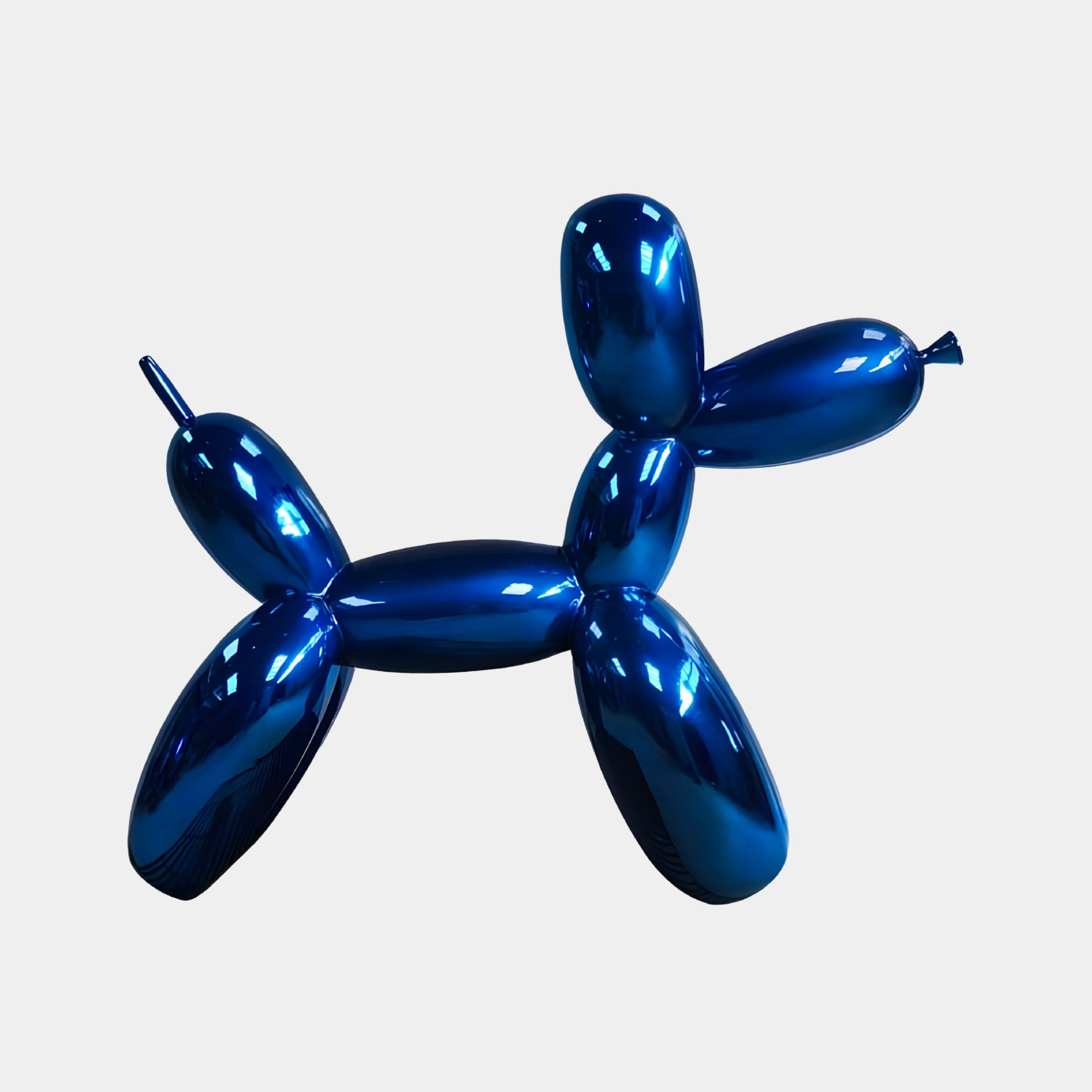 The Ocean Blue Balloon Dog Sculpture by Giant Sculptures stands 80cm tall, embodying Modern Art with its minimalist design. Its reflective surface and vibrant color capture light beautifully, set against a simple, light backdrop.