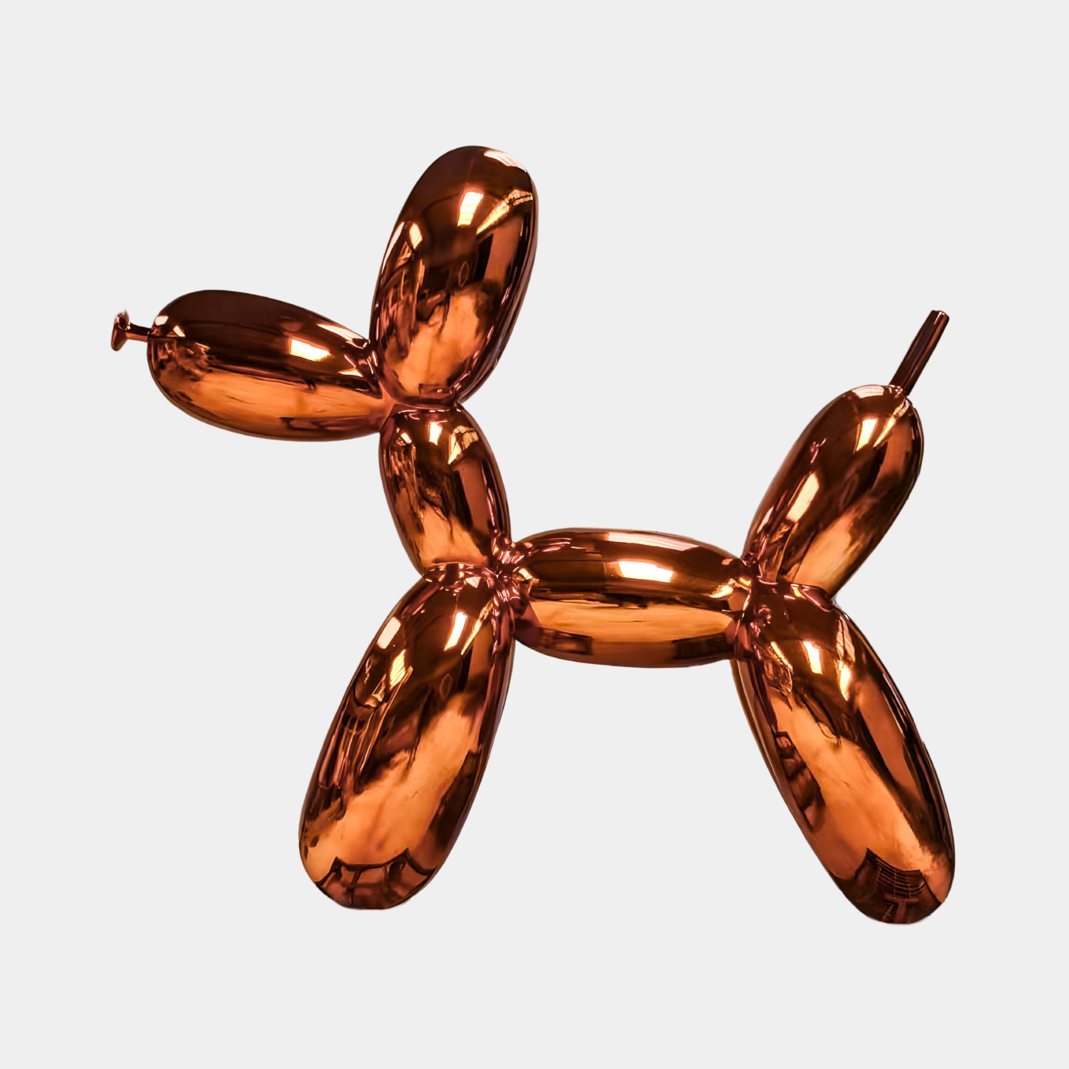 A shiny, metallic Sunset Orange Balloon Dog Sculpture - 80cm by Giant Sculptures, with a reflective copper surface and contemporary look, set against a plain white background.