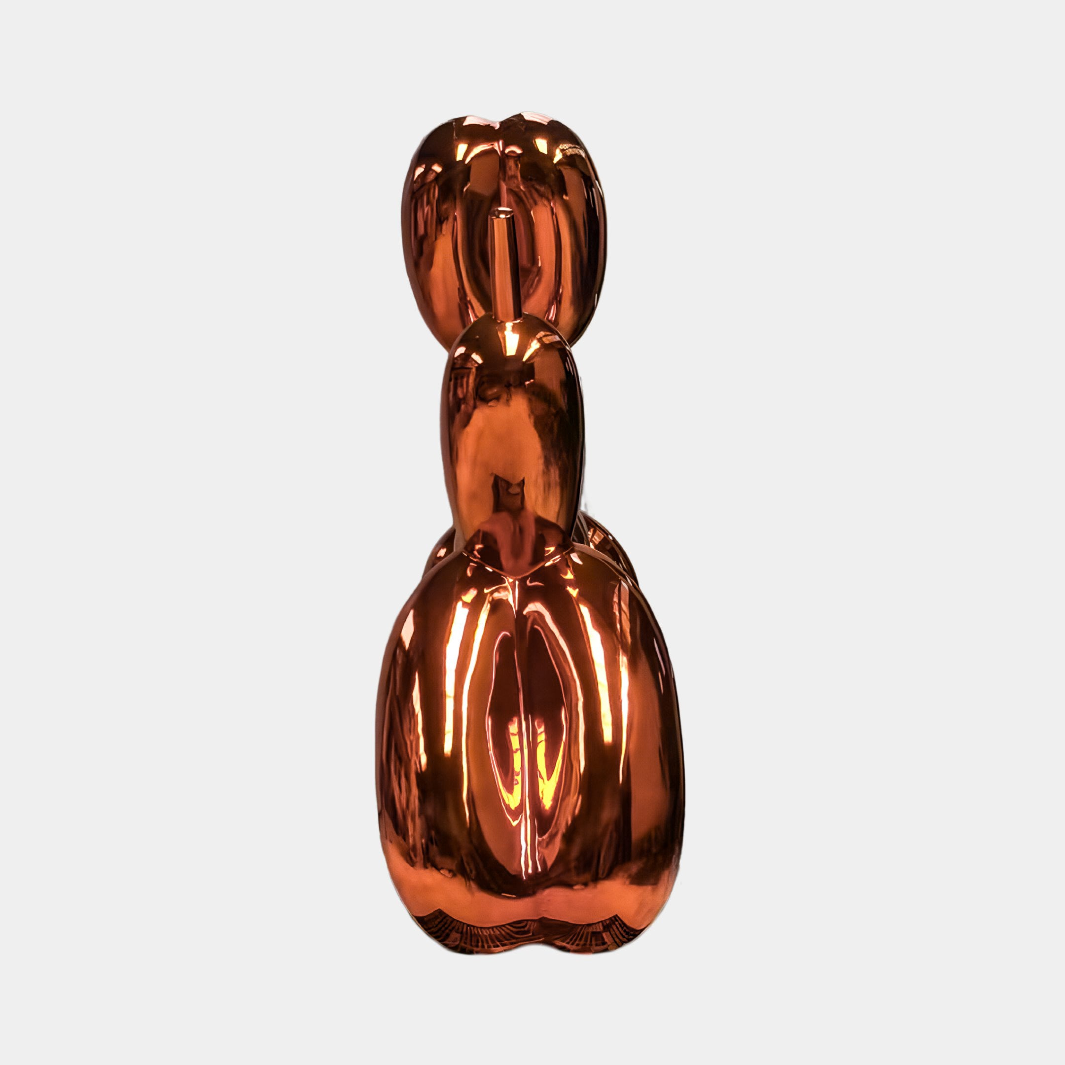 The Sunset Orange Balloon Dog Sculpture (80cm) by Giant Sculptures features a shiny, metallic orange finish and striking contemporary design, displayed against a plain white background.