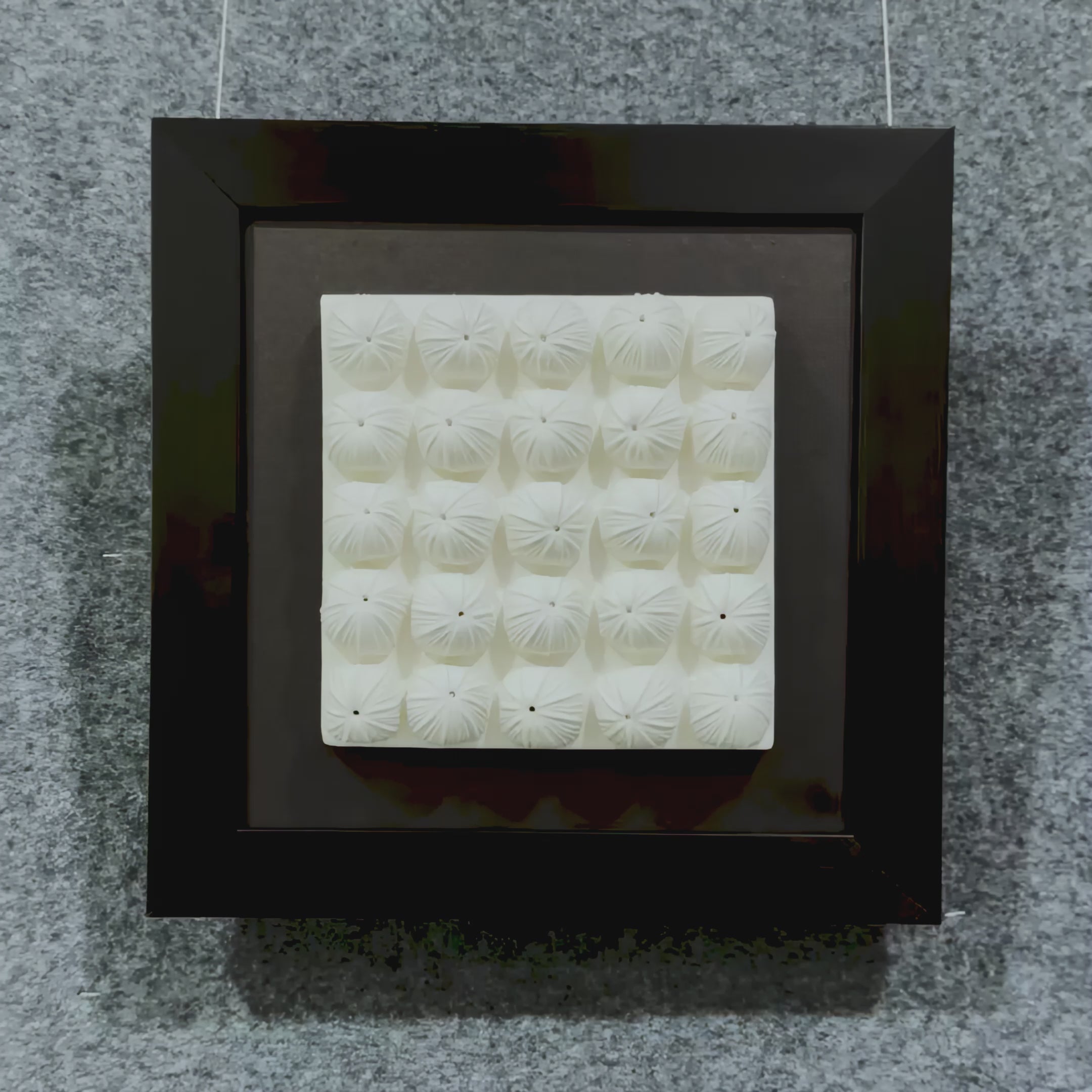 Showcase of the Harmonia 3D Floral Grid Sculpture, featuring rows of sculpted ceramic blooms with pleated detailing, framed in matte black over a dark backdrop.