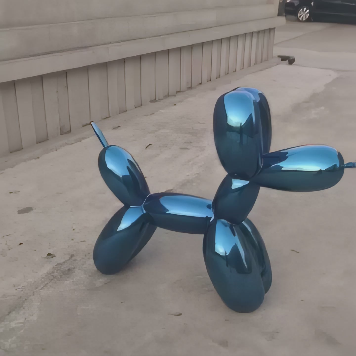 A 360-degree view of Sapphire Blue Balloon Dog Sculpture, showcasing its reflective surface and contemporary design.