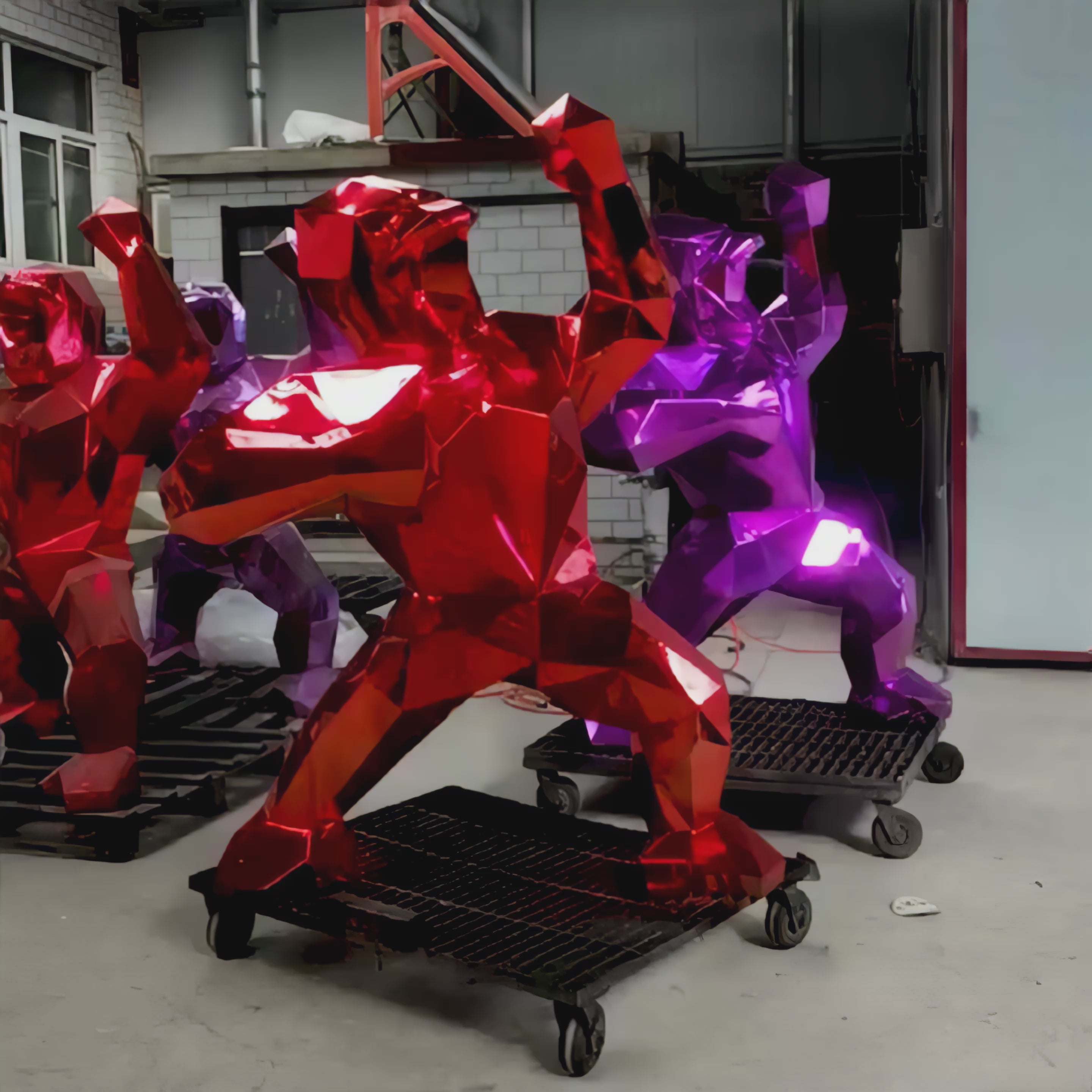 Video showing an electroplated gorilla sculpture. The camera slowly pans around the striking piece, highlighting its reflective metallic finish and intricate details, emphasizing the interplay of light on its smooth, polished surface.