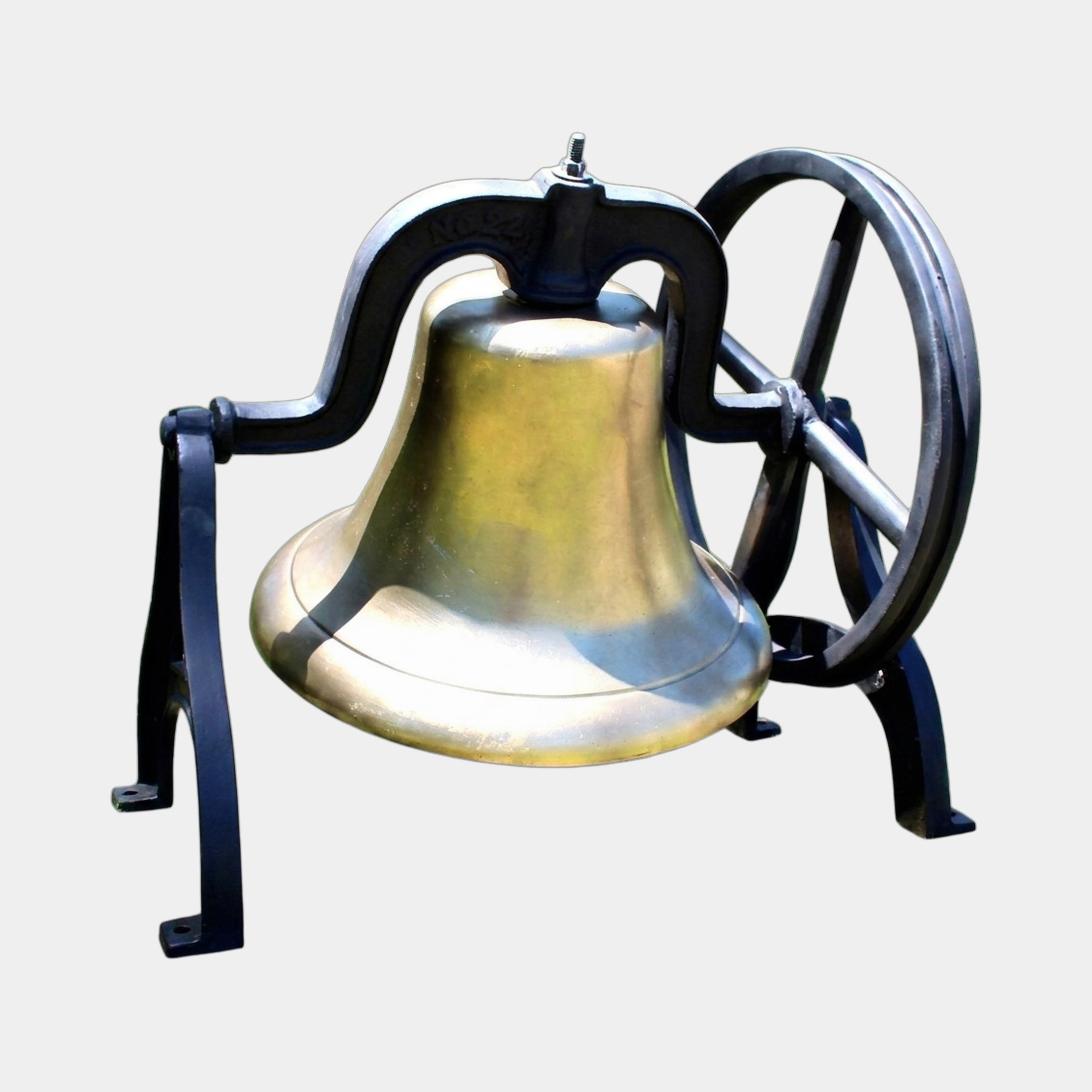 Traditional Church Bell Bronze Sculpture 90cm by Giant Sculptures, golden bronze bell in a matte black scrolled iron yoke with spoked wheel, on a plain background.