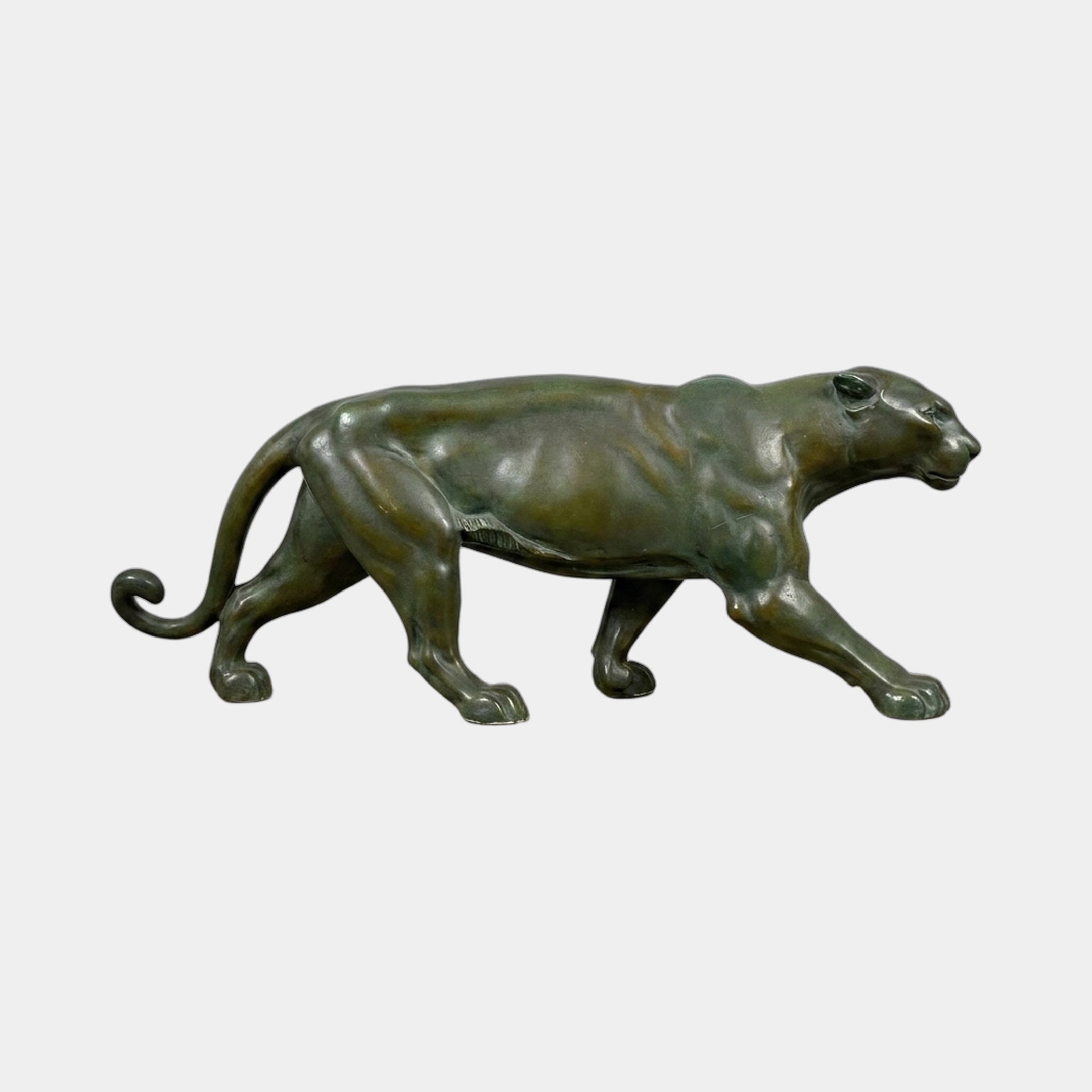 Traditional Prowling Panther Bronze Sculpture by Giant Sculptures in side profile, showing dark green verdigris patina over warm brown tones on a plain background.