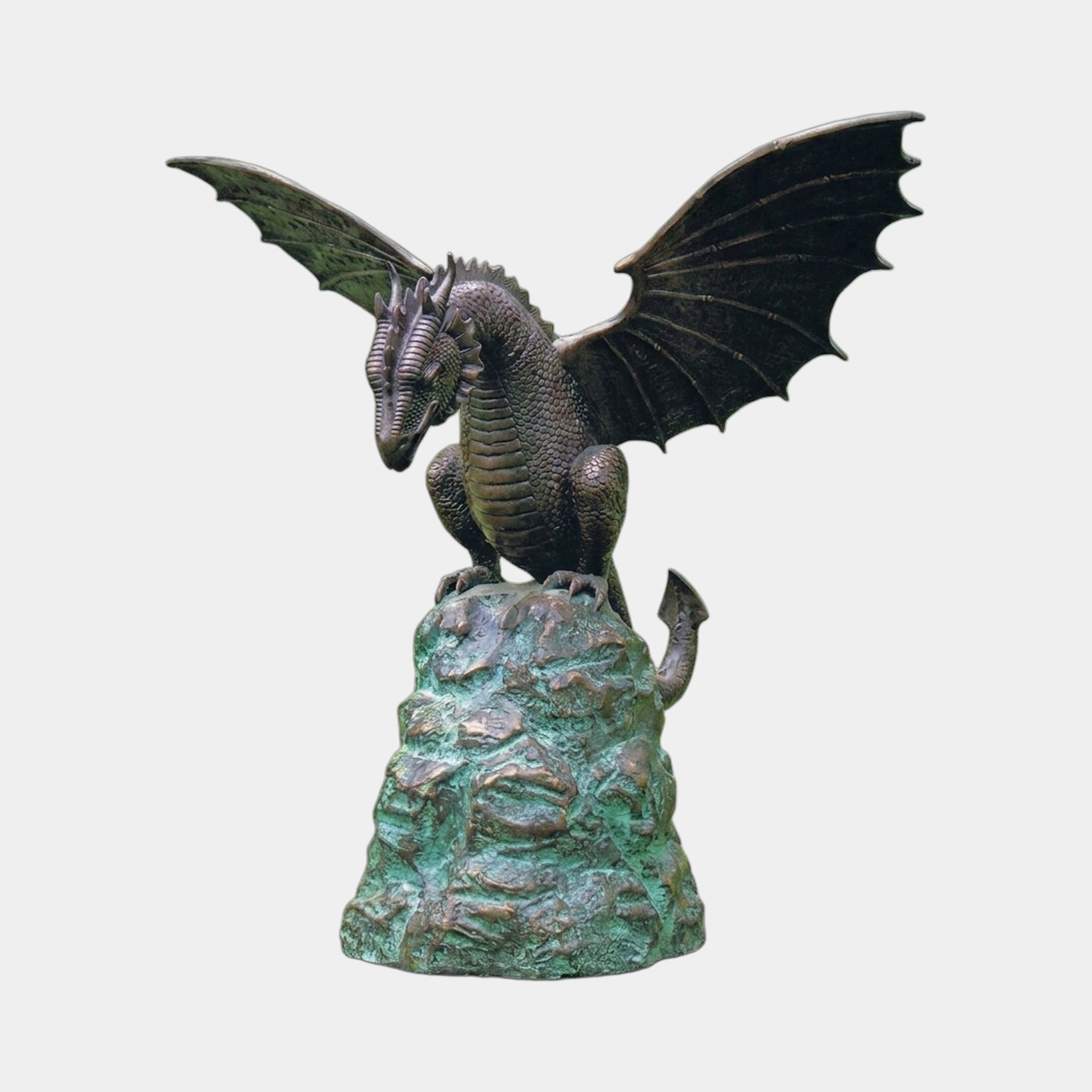 Traditional Winged Dragon Bronze Fountain 150cm by Giant Sculptures, wings spread wide atop a verdigris rocky base, shown against a plain light background.