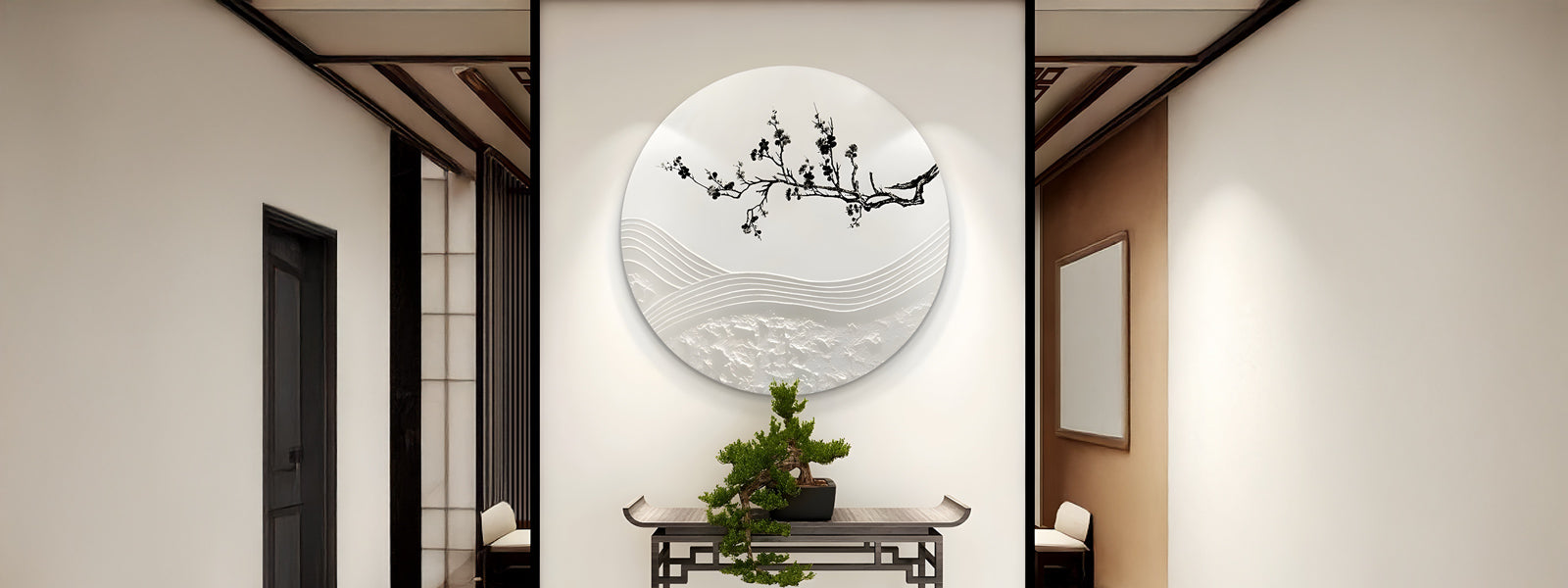 A minimalist hallway with a large circular art piece featuring a black branch and abstract waves. Below, a small bonsai tree sits on a decorative table against a light wall.