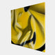 The Smile Fragment Abstract Canvas Wall Art by Giant Sculptures features bold yellow and black graffiti art with sweeping lines and geometric shapes, creating a sense of emotional tension against a plain white background.