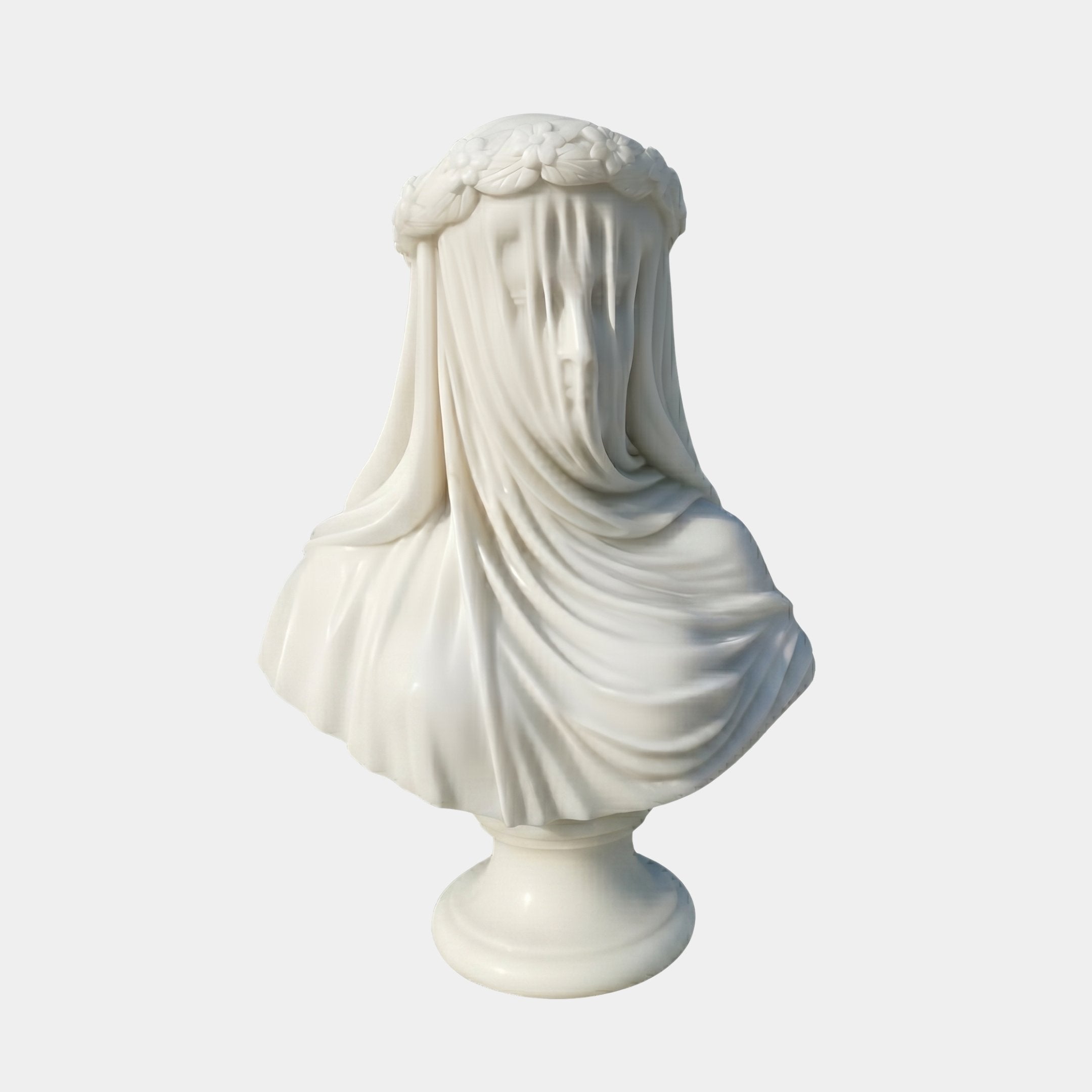 The Veiled Bride Marble Bust Sculpture - 65cm by Giant Sculptures is expertly crafted from white marble, depicting a woman with a flower crown and delicate veiling over her face and shoulders.