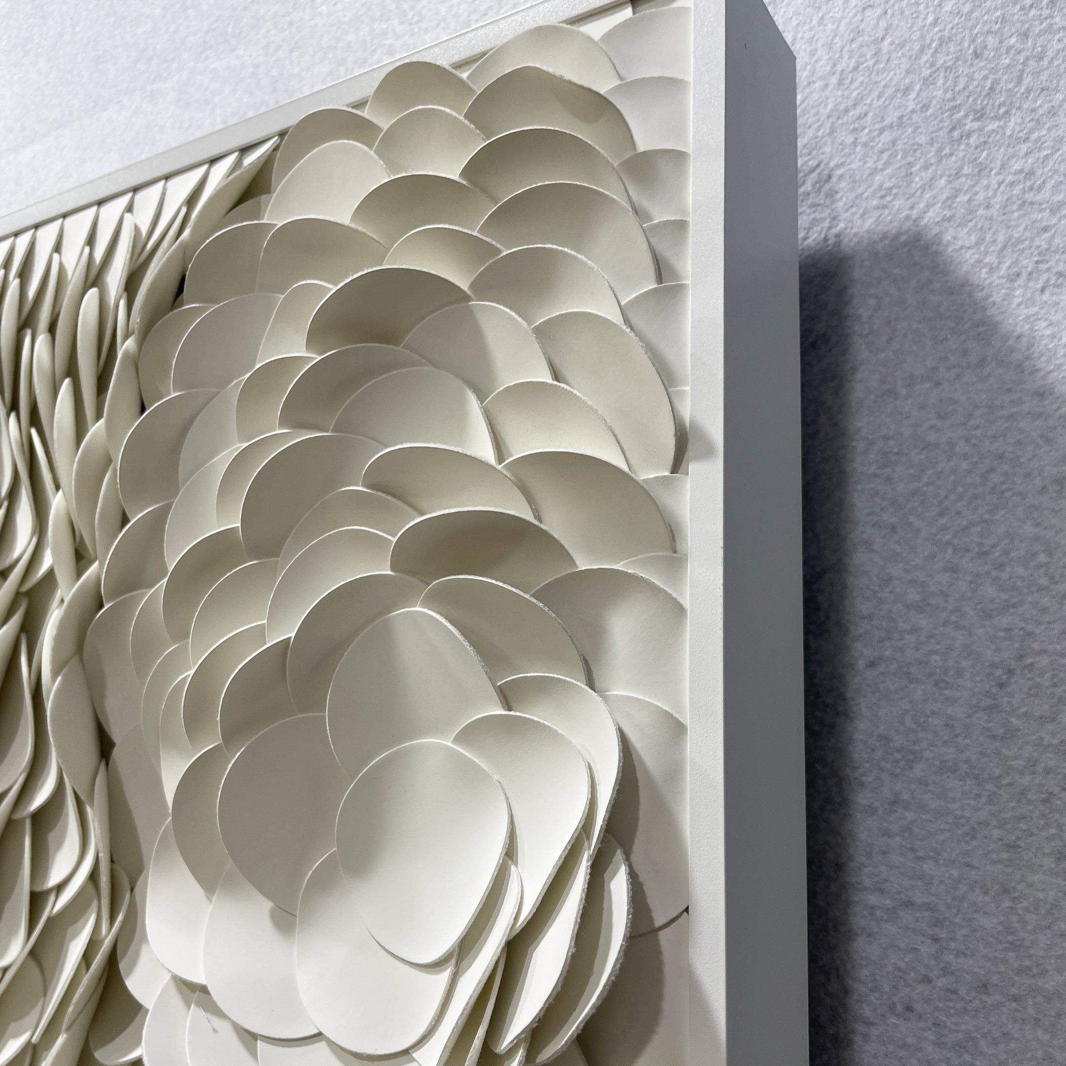 A close-up of the Riverine Flow Pearl White Textured Triptych Wall Art by Giant Sculptures, featuring layered, overlapping circular shapes that create a sculptural textured effect within a rectangular frame.