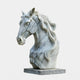 The Graceful Horse Head White Marble Outdoor Sculpture by Giant Sculptures, measuring 60cm, features detailed craftsmanship with a flowing mane and smooth finish. Elegantly presented on a square base, it makes an exquisite outdoor centerpiece.