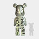 The Inside Appears Outside 3 Bear Sculpture - 50cm by Giant Sculptures features a silver, mirror-like upright bear adorned with abstract black geometric patterns. A faint silhouette of the same figure appears to the right on a plain white background.