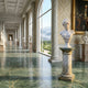 The Classical Youth Marble Bust Sculpture - 65cm by Giant Sculptures stands on a pedestal in an elegant hallway with marble floors, tall windows, classical statues, ornate walls, and views of a manicured garden and distant mountains.