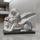 The Giant Winged Lion Marble Outdoor Sculpture - 160cm by Giant Sculptures features a majestic lion with feathered wings and a lion’s head under its paw—perfect as a bold statement piece for modern indoor or outdoor spaces.