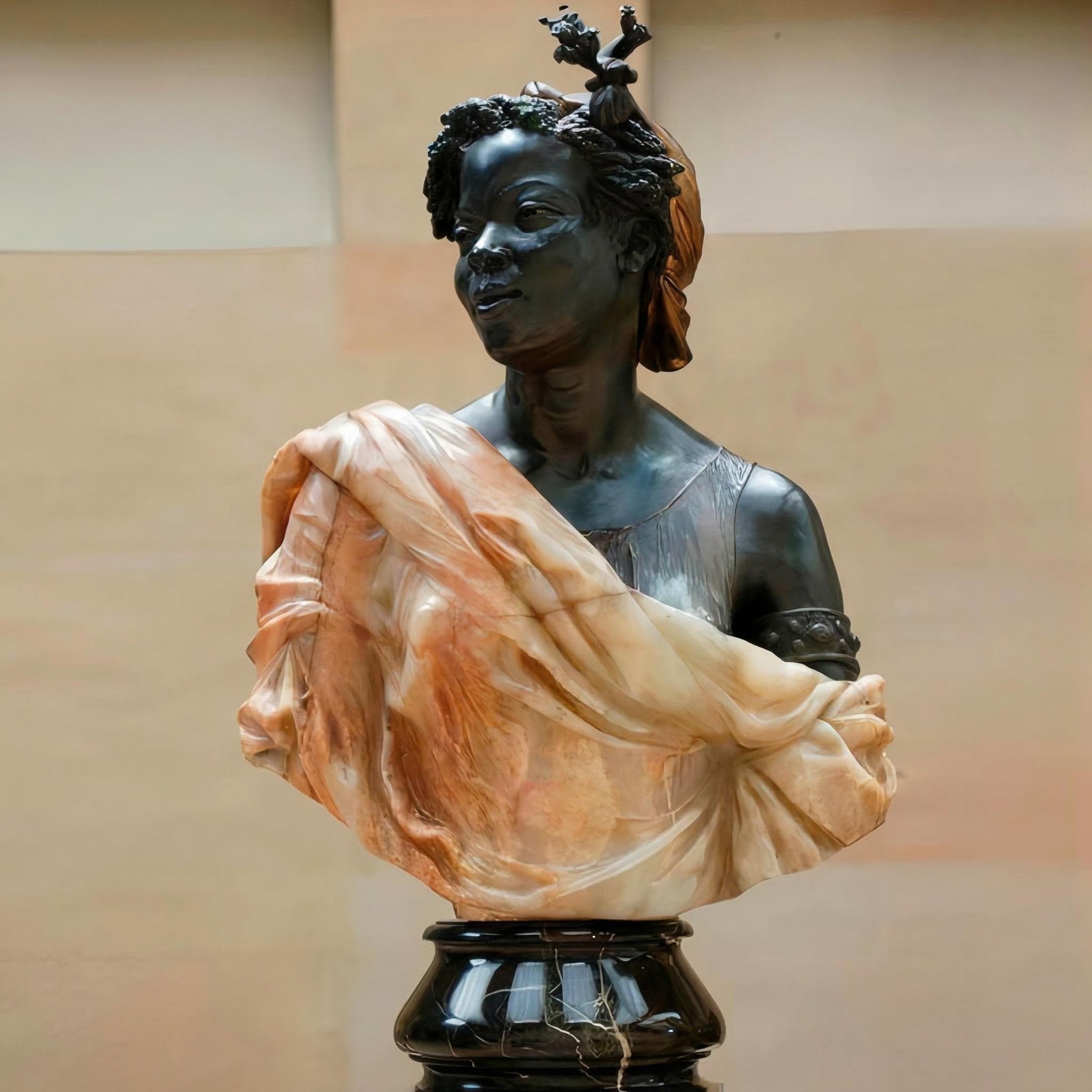 African Female Marble Bust Sculpture – 80cm by Giant Sculptures featuring a dark polished stone portrait with terracotta-toned marble drapery, carved crown detail, and elegant dark base against a warm neutral background.