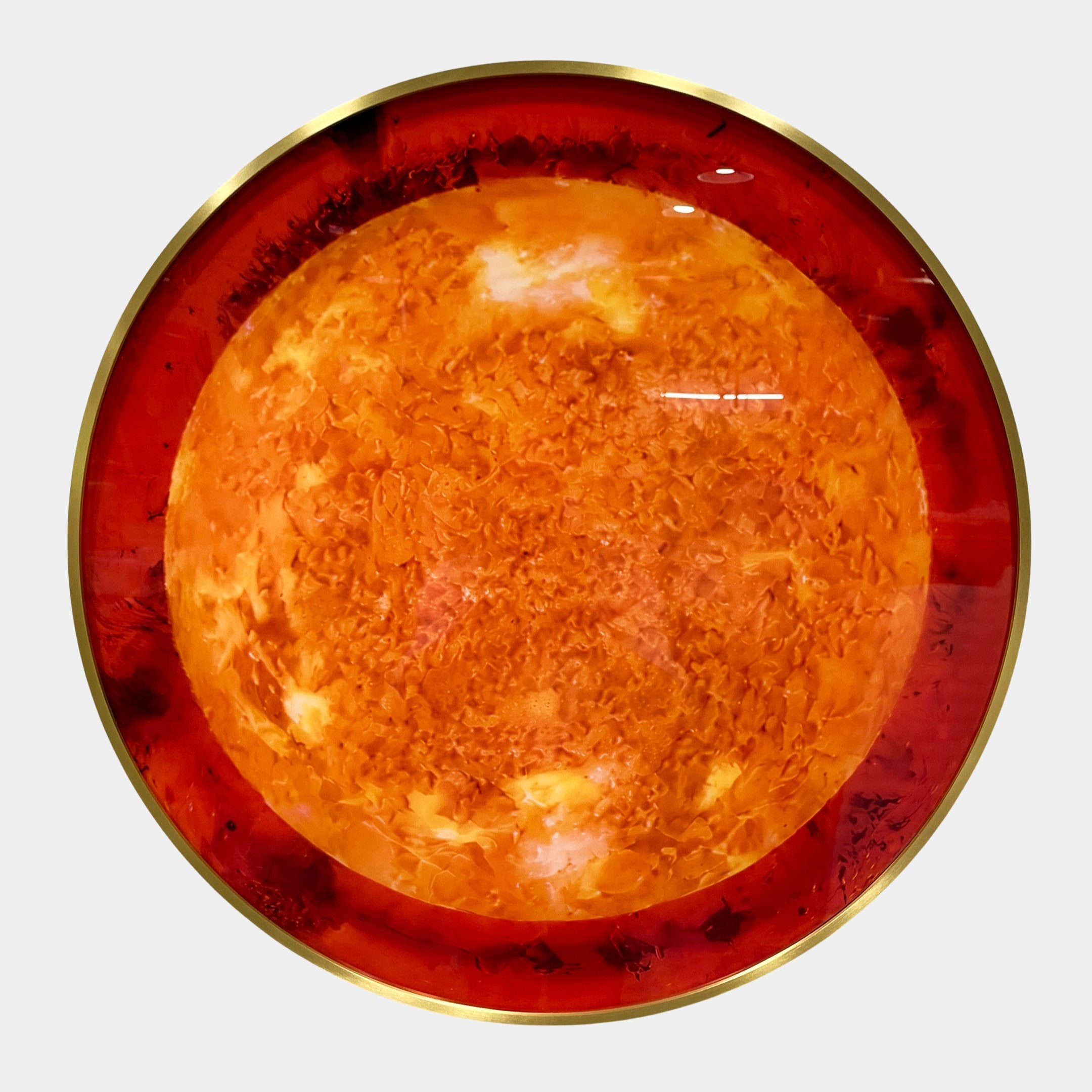 Galaxia Sun Crystal Porcelain LED Wall Art by Giant Sculptures shown head-on, with a textured amber-orange core radiating into a deep red ring and brass-toned edge.