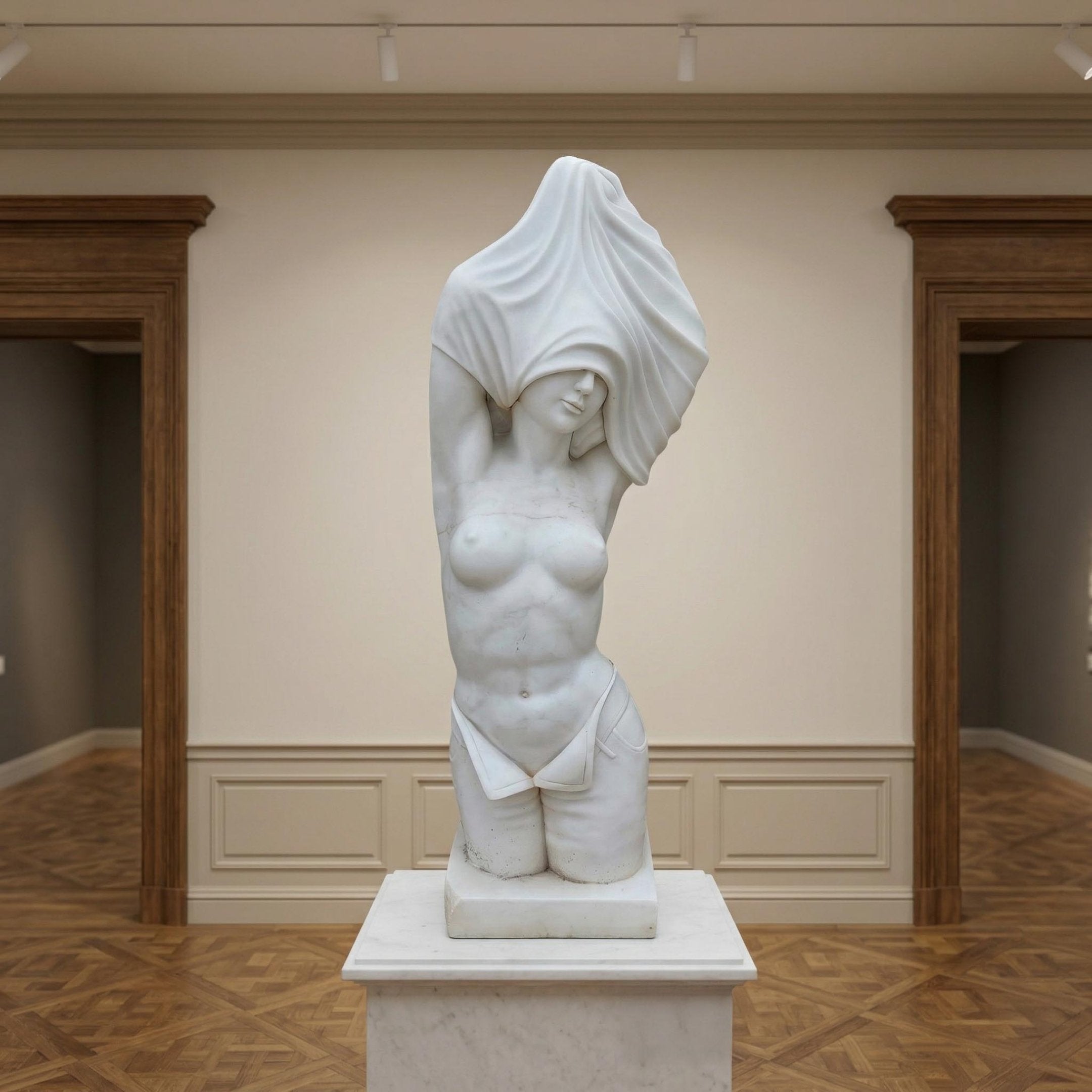 The Female Marble Torso Sculpture - 80cm by Giant Sculptures, carved from natural white marble, stands on a pedestal in a gallery with wooden floors. The partially draped figure's head and one arm are veiled by flowing fabric.