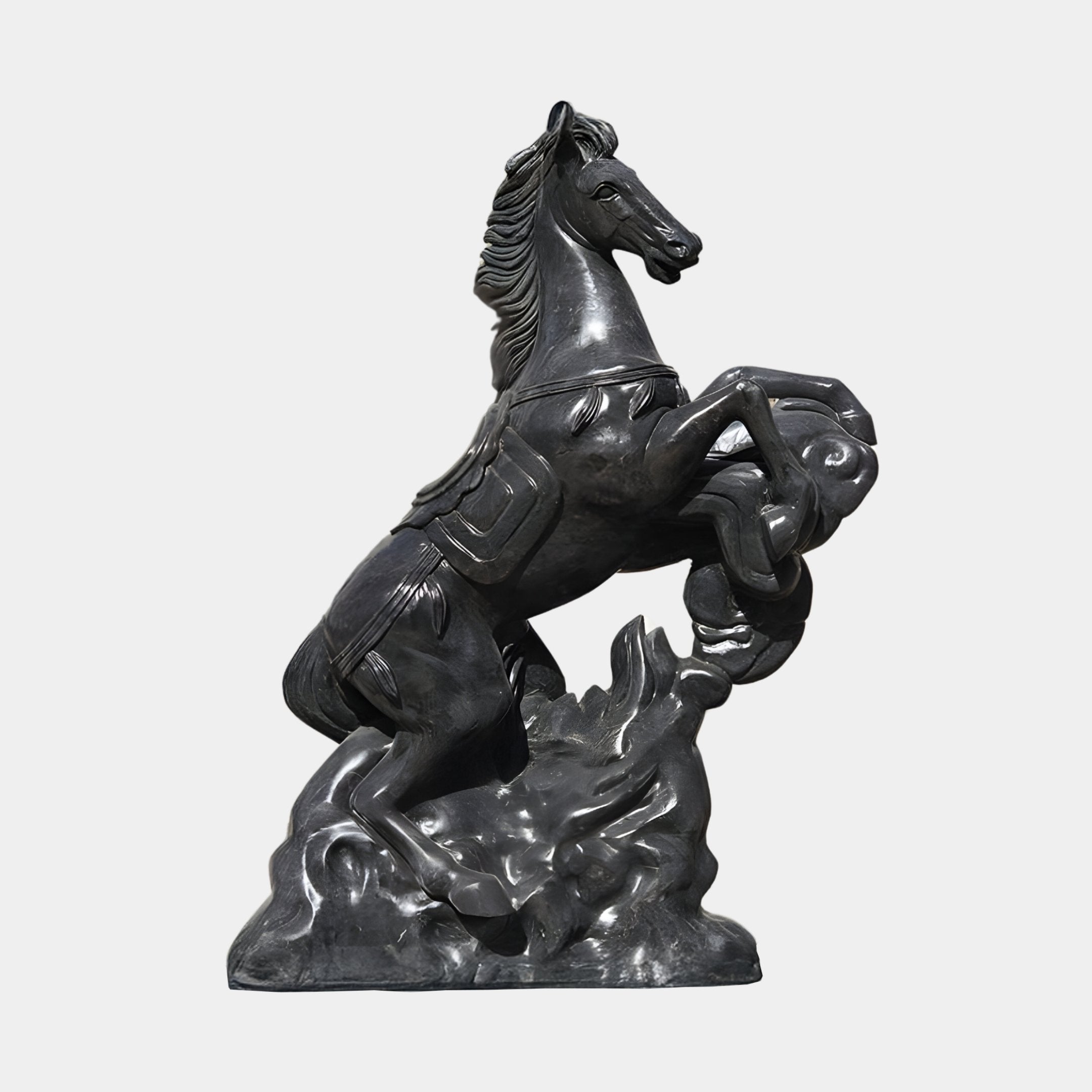 The Rearing Horse Black Marble Outdoor Sculpture by Giant Sculptures stands 200cm tall, showcasing a detailed rearing horse with a flowing mane and tail on a rocky base, capturing movement and strength.