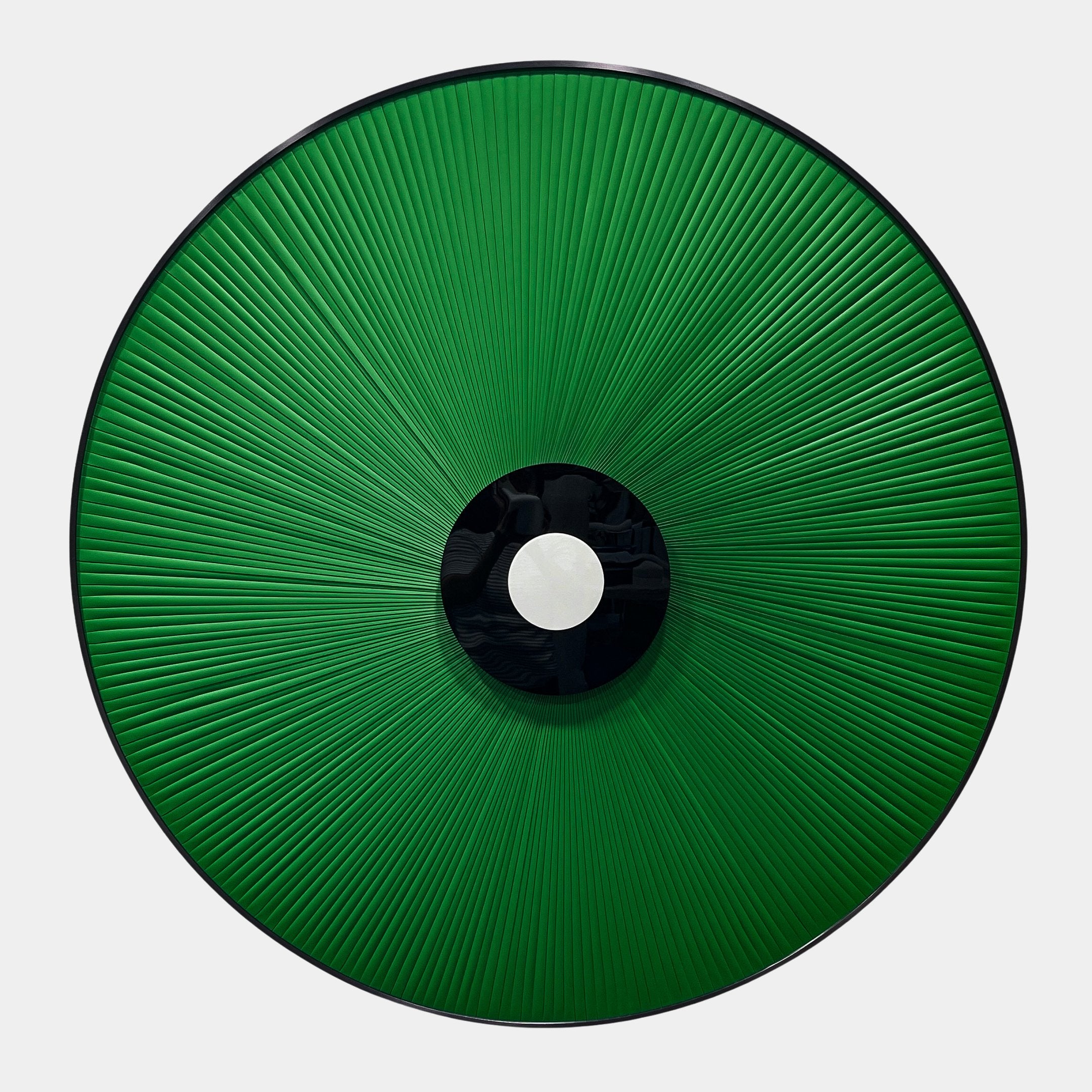 Vanguard Jade Surge Leather 3D LED Wall Art by Giant Sculptures, a circular sunburst of jade-green leather rays around a black-and-white disc on a pale background.