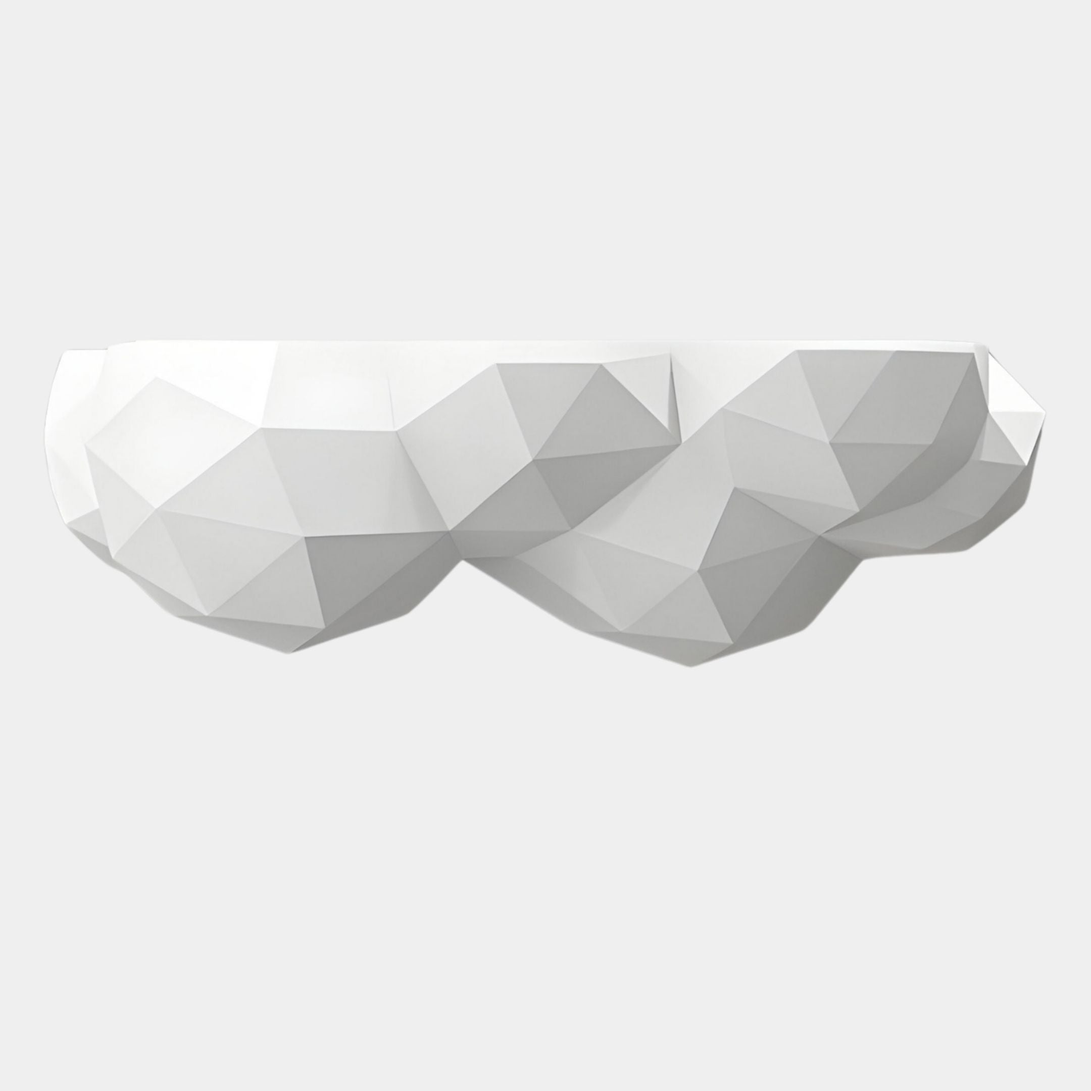 A functional décor piece, the White Geometric Cloud 3D Wall Shelf by Giant Sculptures features an angular, polygon-inspired design and is mounted against a plain light gray background.