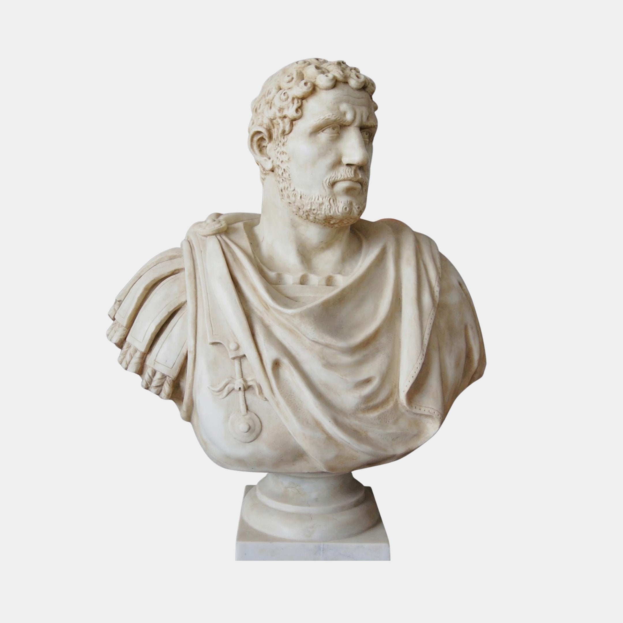The Julius Caesar Marble Bust Sculpture (85cm) by Giant Sculptures features detailed drapery and armor, expertly crafted in natural white marble—a striking example of Roman artistry, showcased against a plain white background.