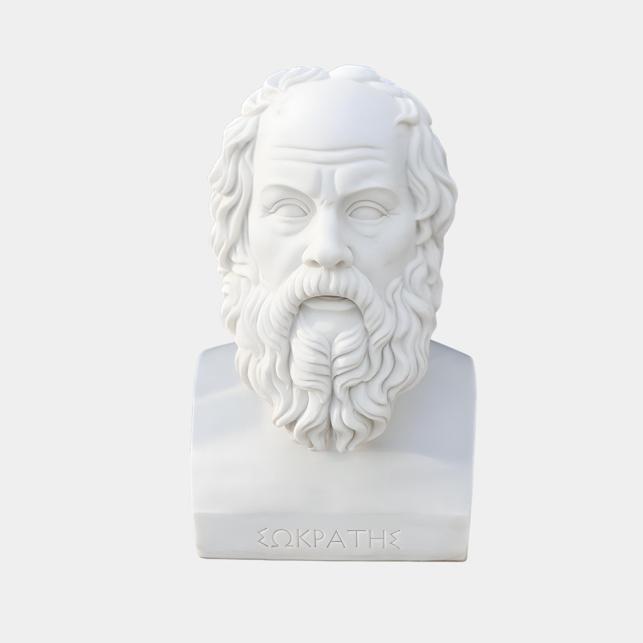 The Socrates Marble Bust Sculpture - 50cm by Giant Sculptures features an elderly bearded man with wavy hair in classical style, Greek letters inscribed at the base, and a plain light gray background.