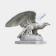 The Steadfast Gaze Eagle Marble Outdoor Sculpture - 120cm by Giant Sculptures features a majestic guardian with partially spread wings on a circular base, displaying intricate feather carvings. This elegant outdoor sculpture exemplifies strength and grace.