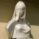 The Veiled Madonna Marble Bust Sculpture - 90cm by Giant Sculptures is delicately carved from natural white marble with intricate fabric details and a serene face, while one shoulder remains unfinished for artistic effect.