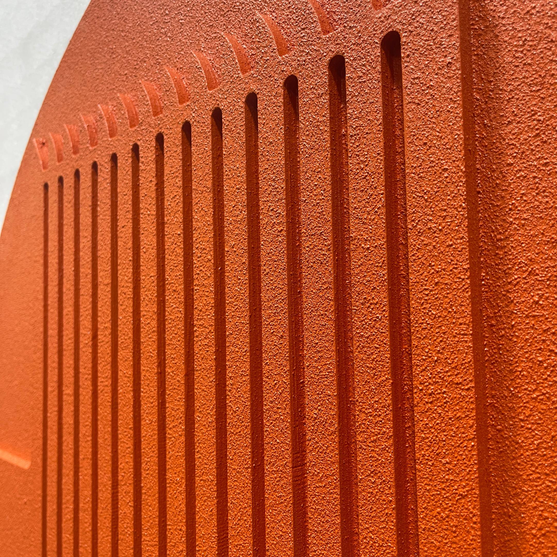 Close-up of the Arcuza Terracotta I Wood Carving Sandstone 3D Wall Art by Giant Sculptures, showing vertical fluted slats and arched recesses in matte terracotta.