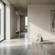 Giant Sculptures 40cm Carrara marble tote bag sculpture with grey veining, displayed on a low plinth in a minimalist concrete-ceilinged gallery interior.