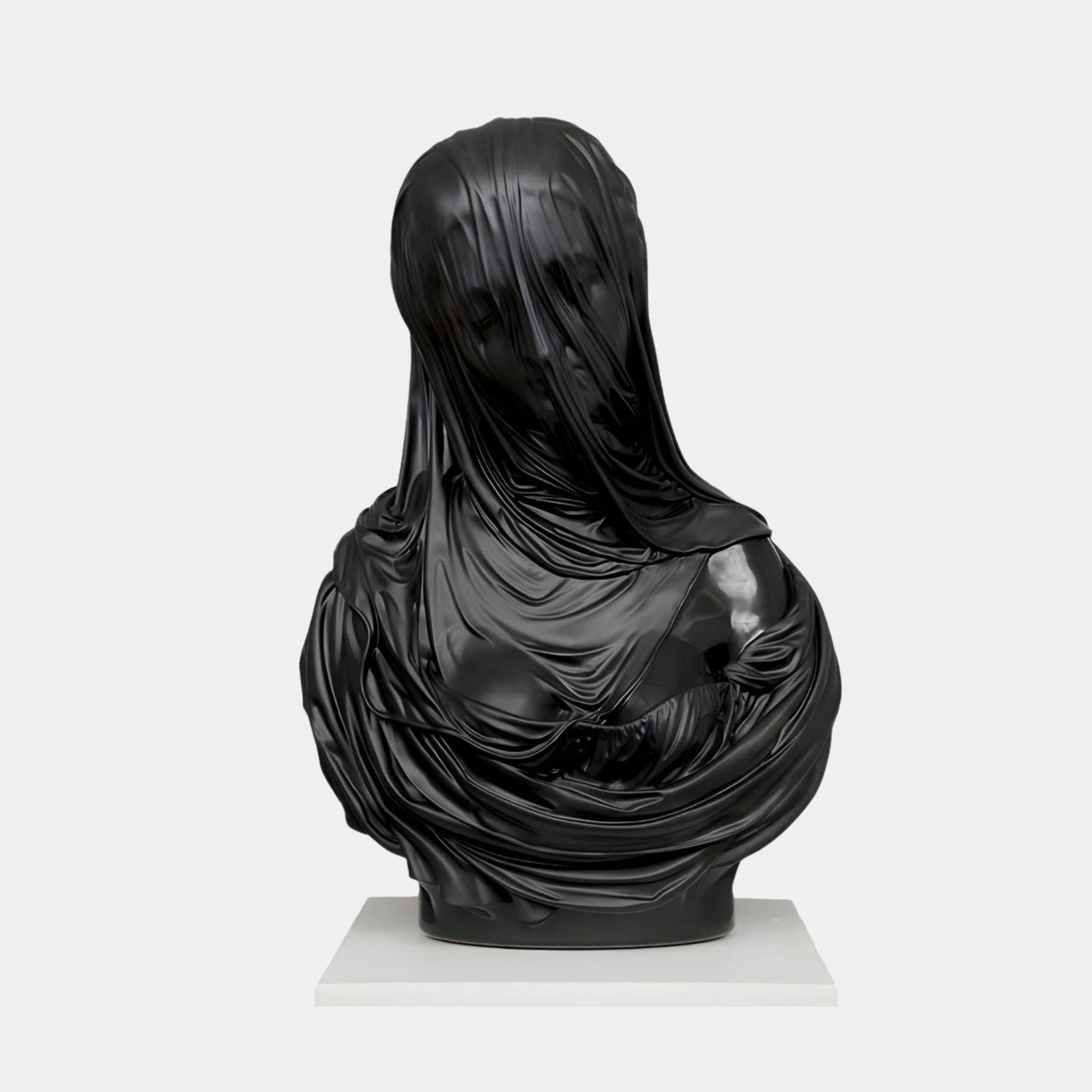 The Giant Sculptures Black Marble Veiled Figure Bust Sculpture - 60cm displays a veiled head and shoulders with fabric-like folds on a white rectangular base, set against a plain light gray background.